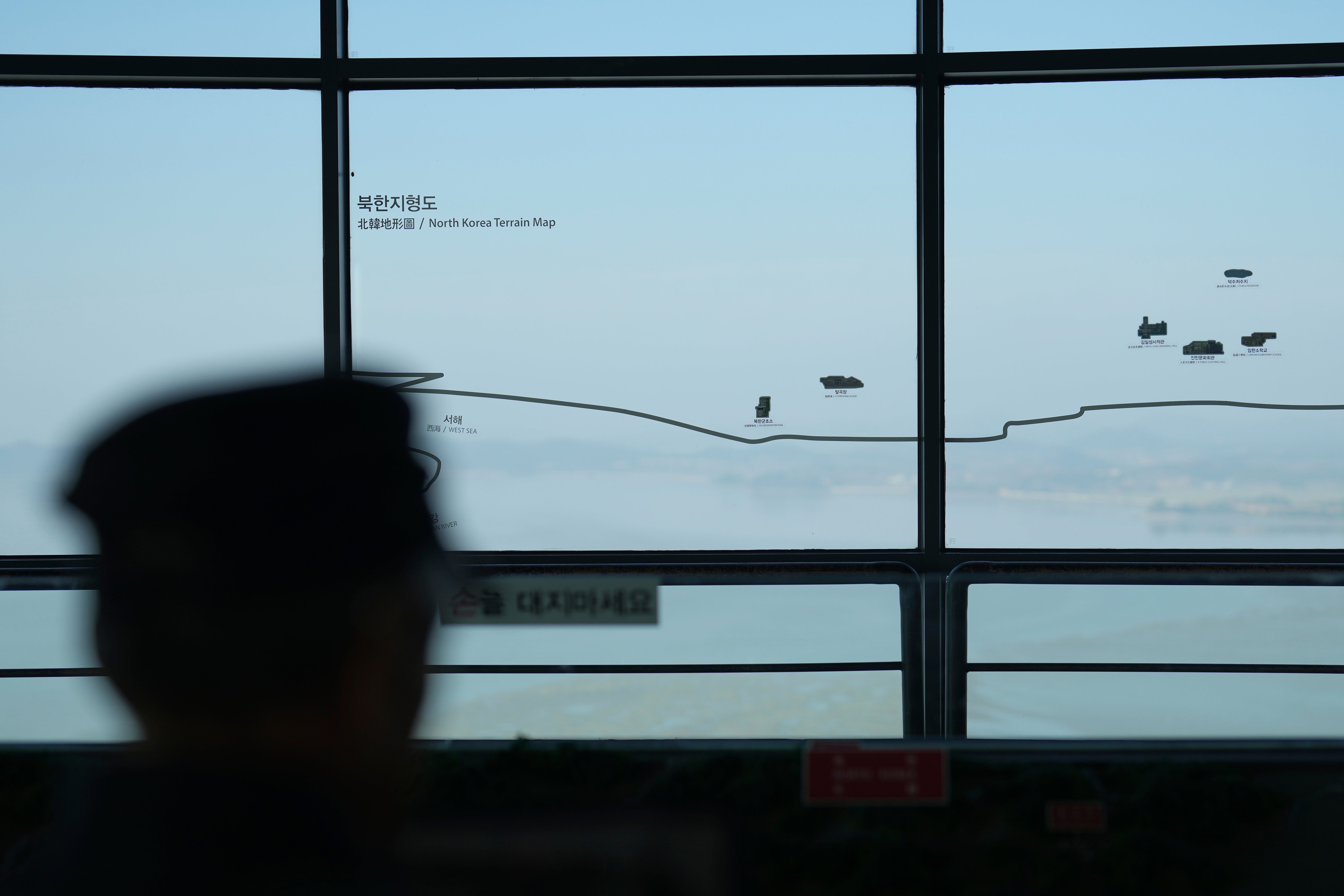 A visitor looks at the North Korean side from the unification observatory in Paju, South Korea