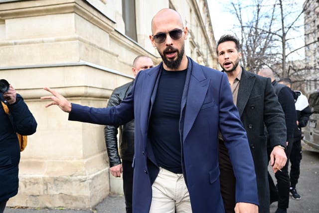 <p>Andrew Tate (L) and Tristan Tate (R) walk from the Bucharest's Court of Appeal</p>