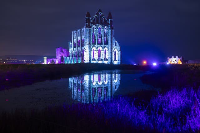 Lights illuminate the ruins of Whitby Abbey in North Yorkshire to mark Halloween (Danny Lawson/PA)