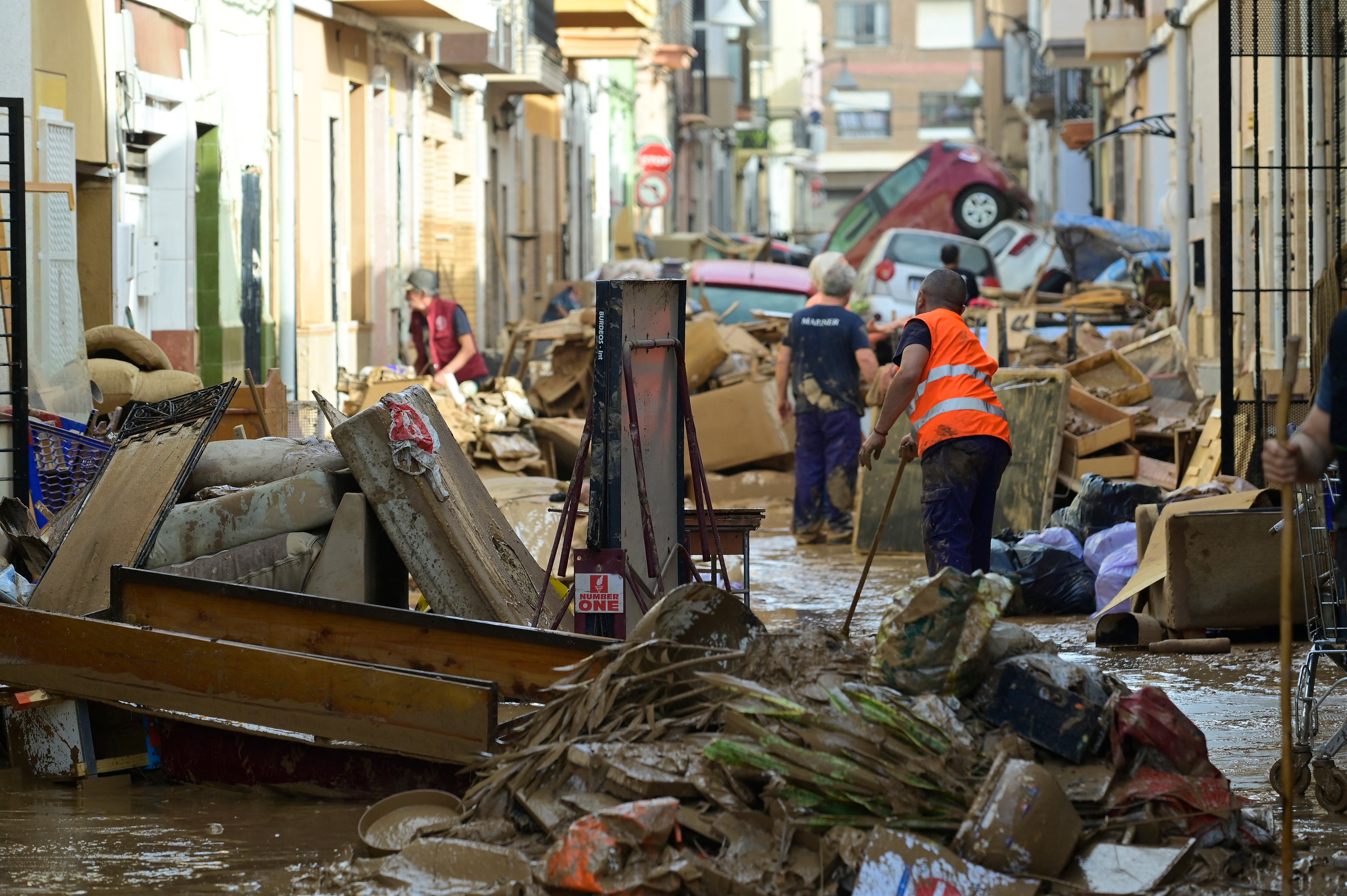 Residents try to clean their homes in the Valencian town of Alfafara