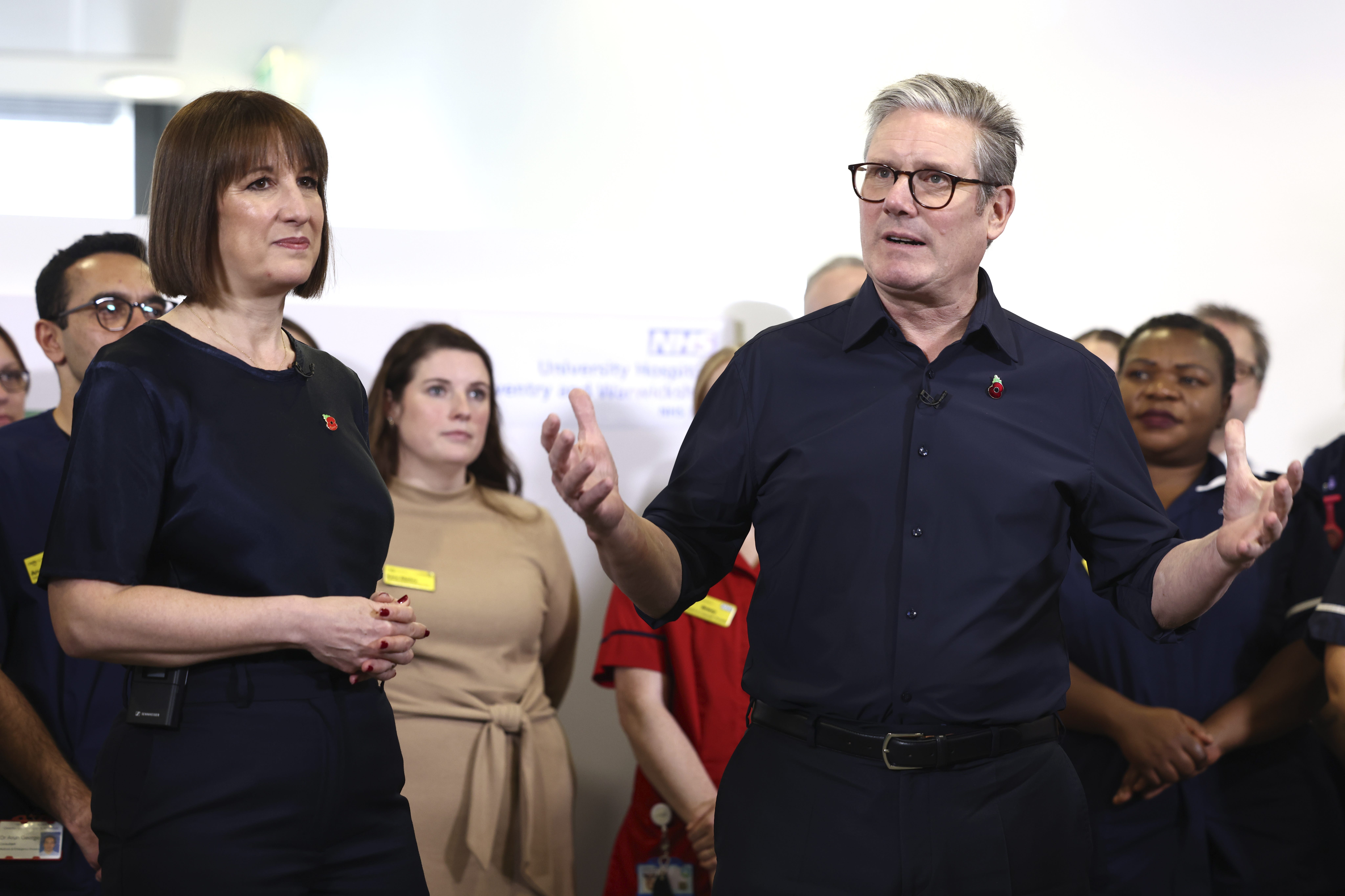 Prime Minister Sir Keir Starmer and Chancellor Rachel Reeves speak to members of staff while visiting University Hospital Coventry and Warwickshire (Darren Staples/PA)