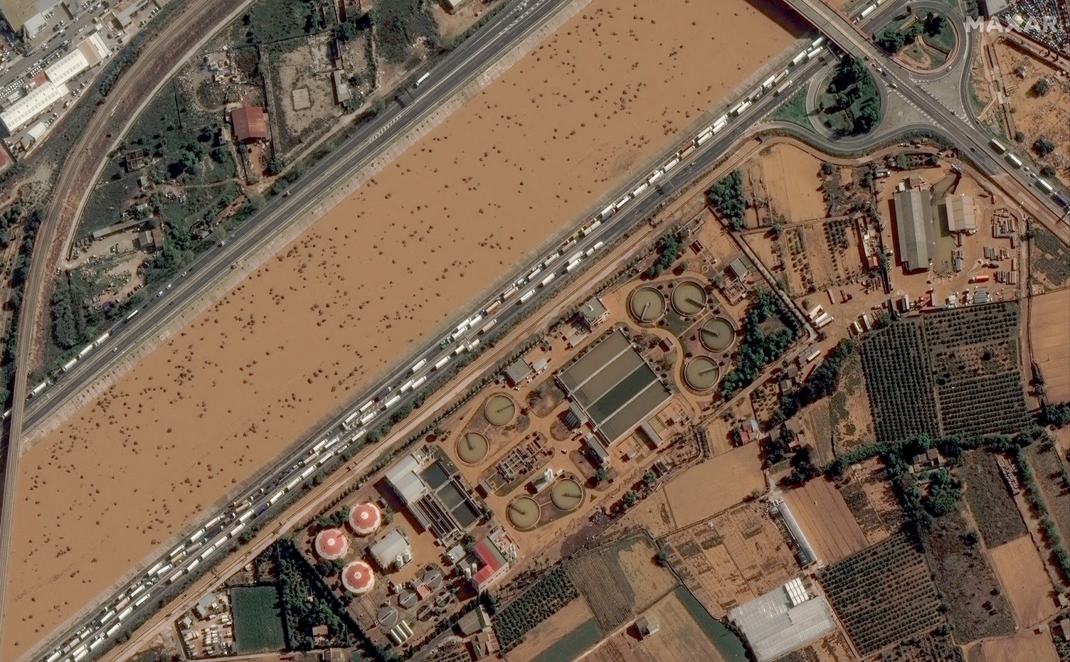 Satellite picture shows Valencia’s water treatment plant and v30 highway after deadly flash floods