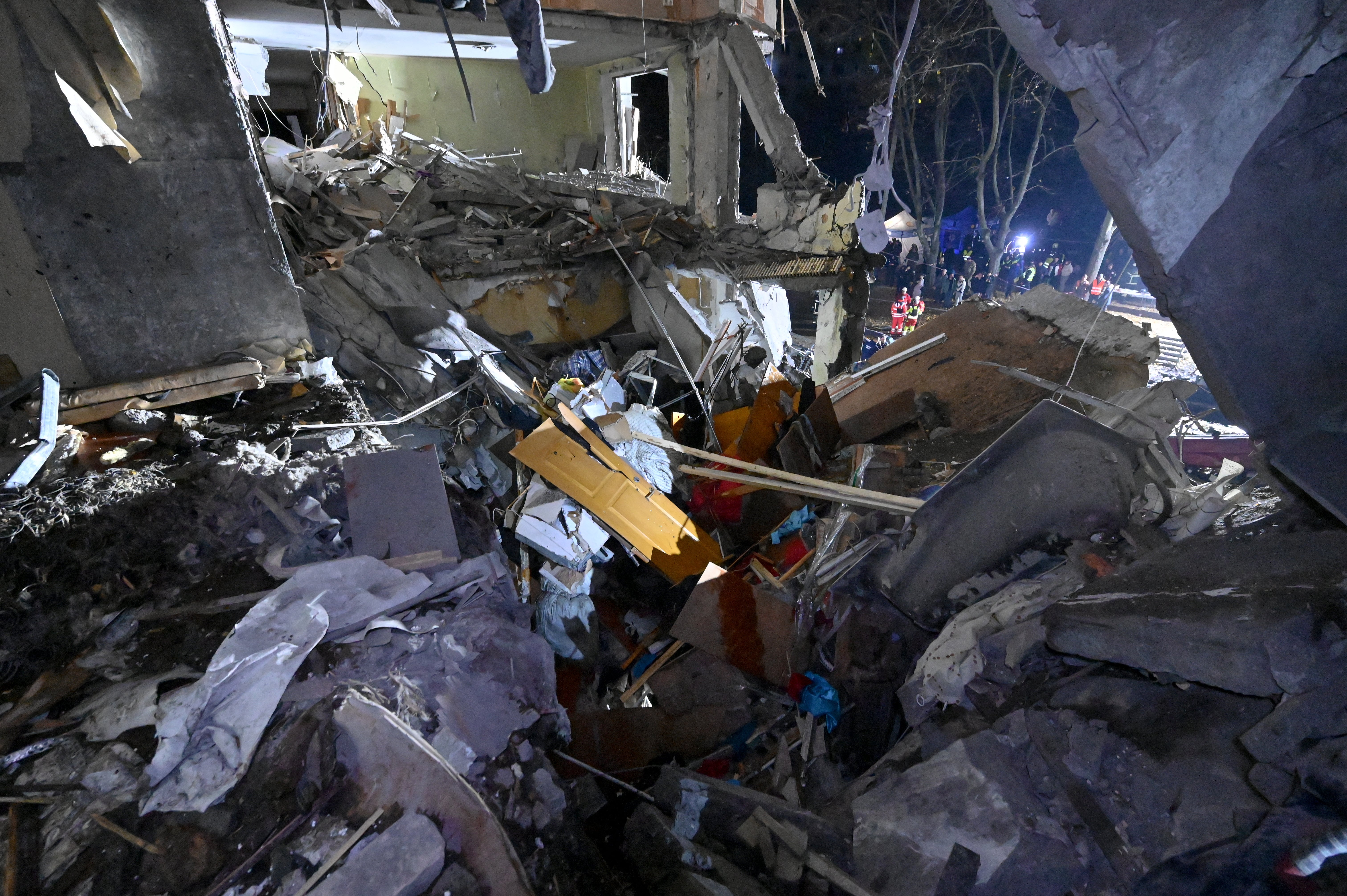 State Emergency Service of Ukraine rescuers hunt  done  debris astatine  an flat  gathering  damaged by a Russian airstrike successful  Kharkiv connected  31 October 2024