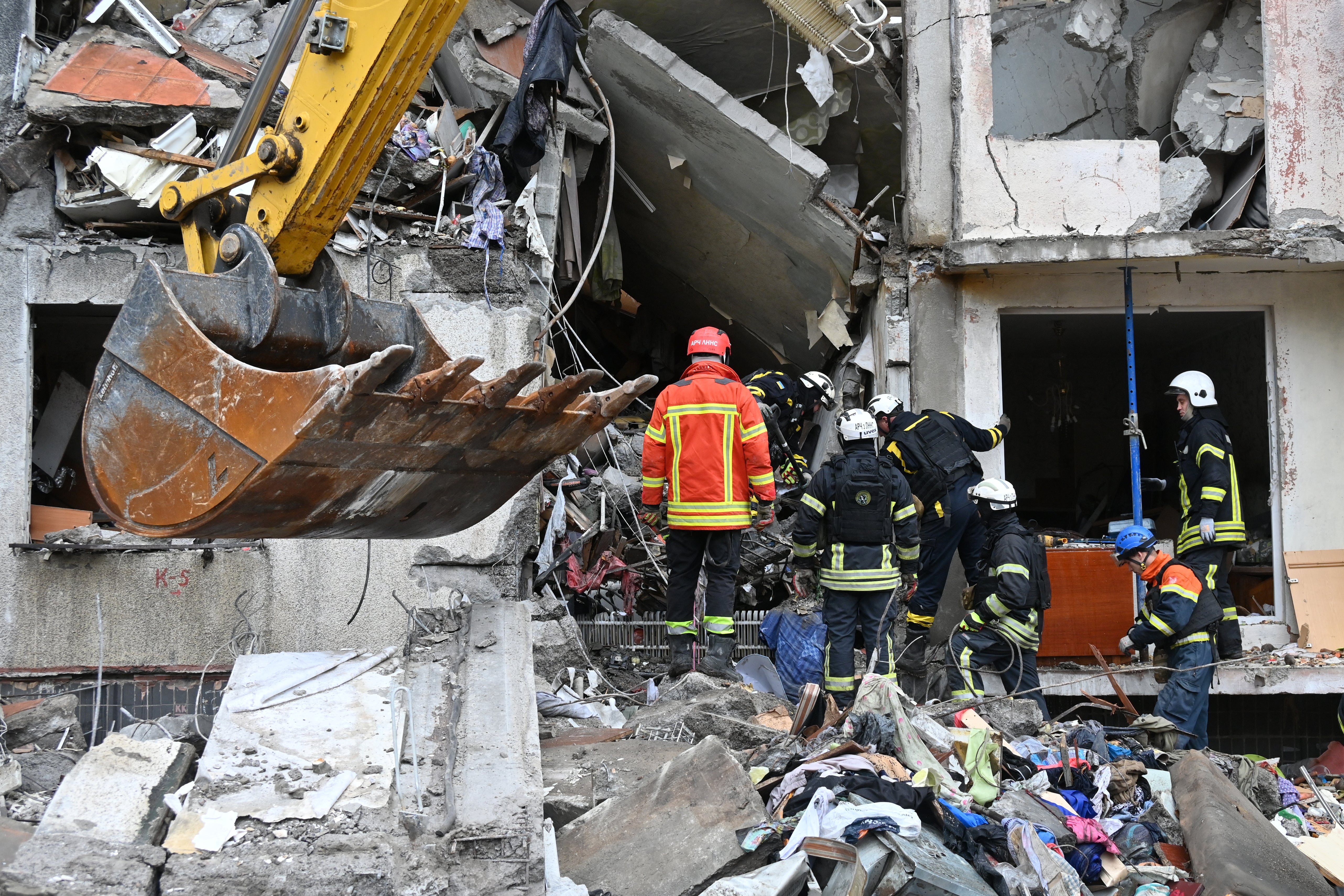 Ukrainian rescuers enactment    astatine  the tract  of a Russian rocket  onslaught  successful  Kharkiv connected  31 October 2024