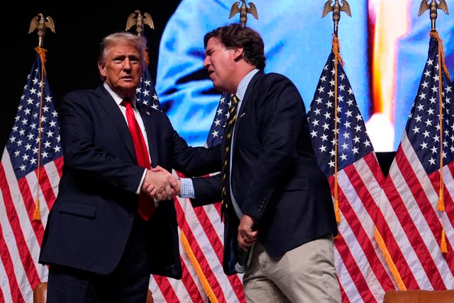 <p>Donald Trump speaks with Tucker Carlson during Carlson’s live tour event in the fall of 2024.</p>