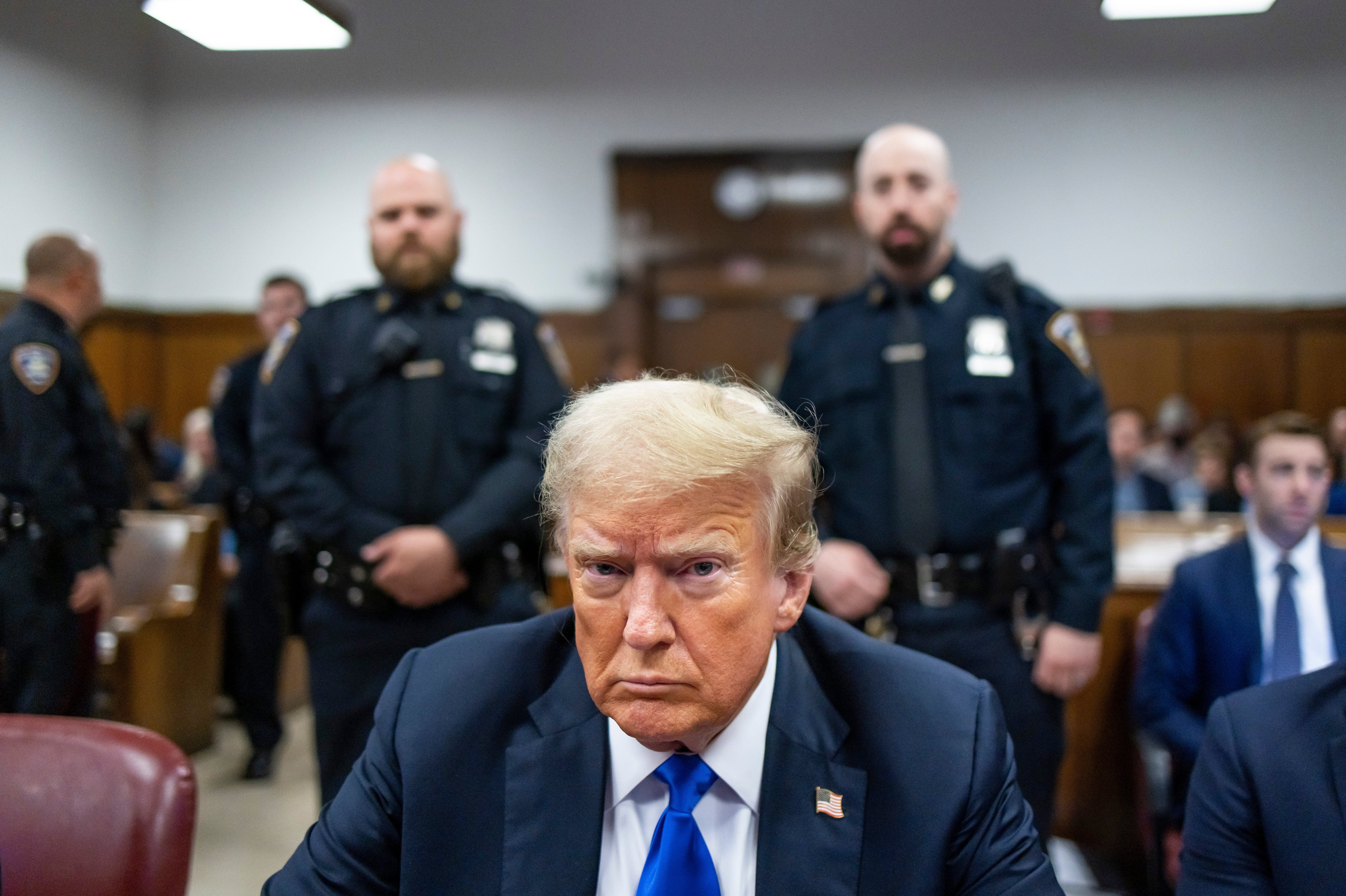 Trump sits at the defendant's table in Manhattan Criminal Court, where he was found guilty on 34 counts, becoming the first former US president to be convicted of crimes