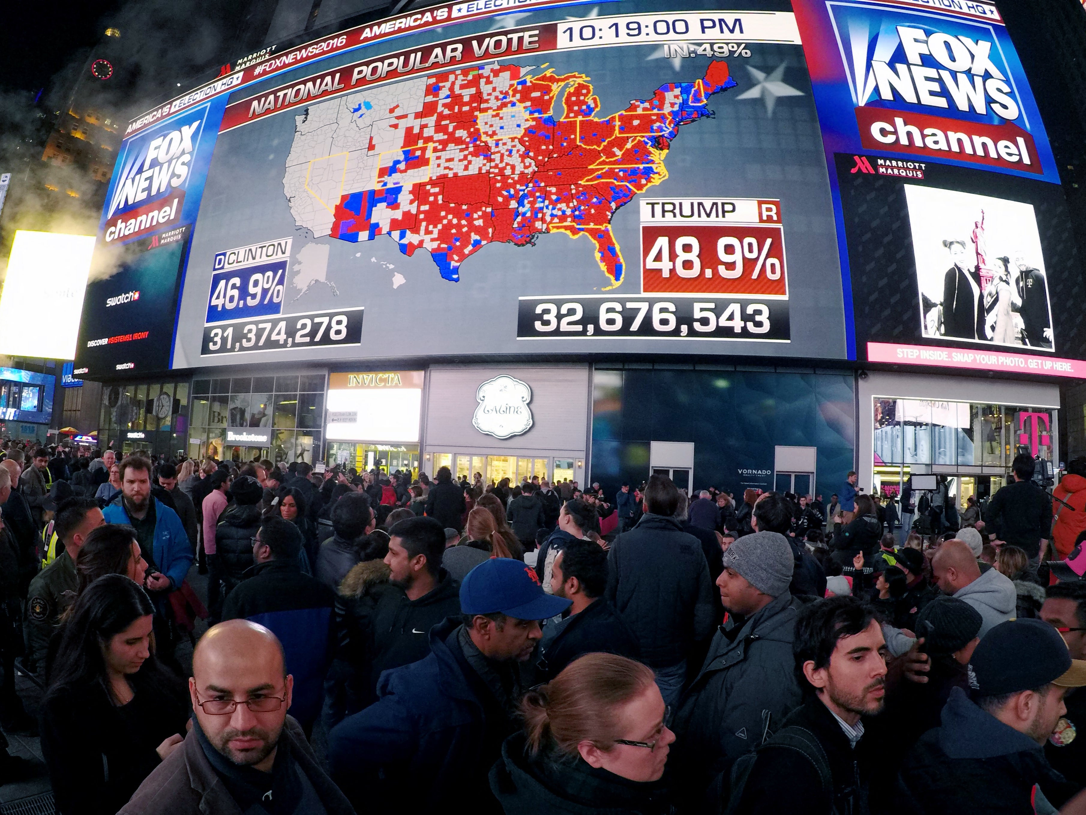 People gather in Times Square to see the early results of the 2016 presidential election