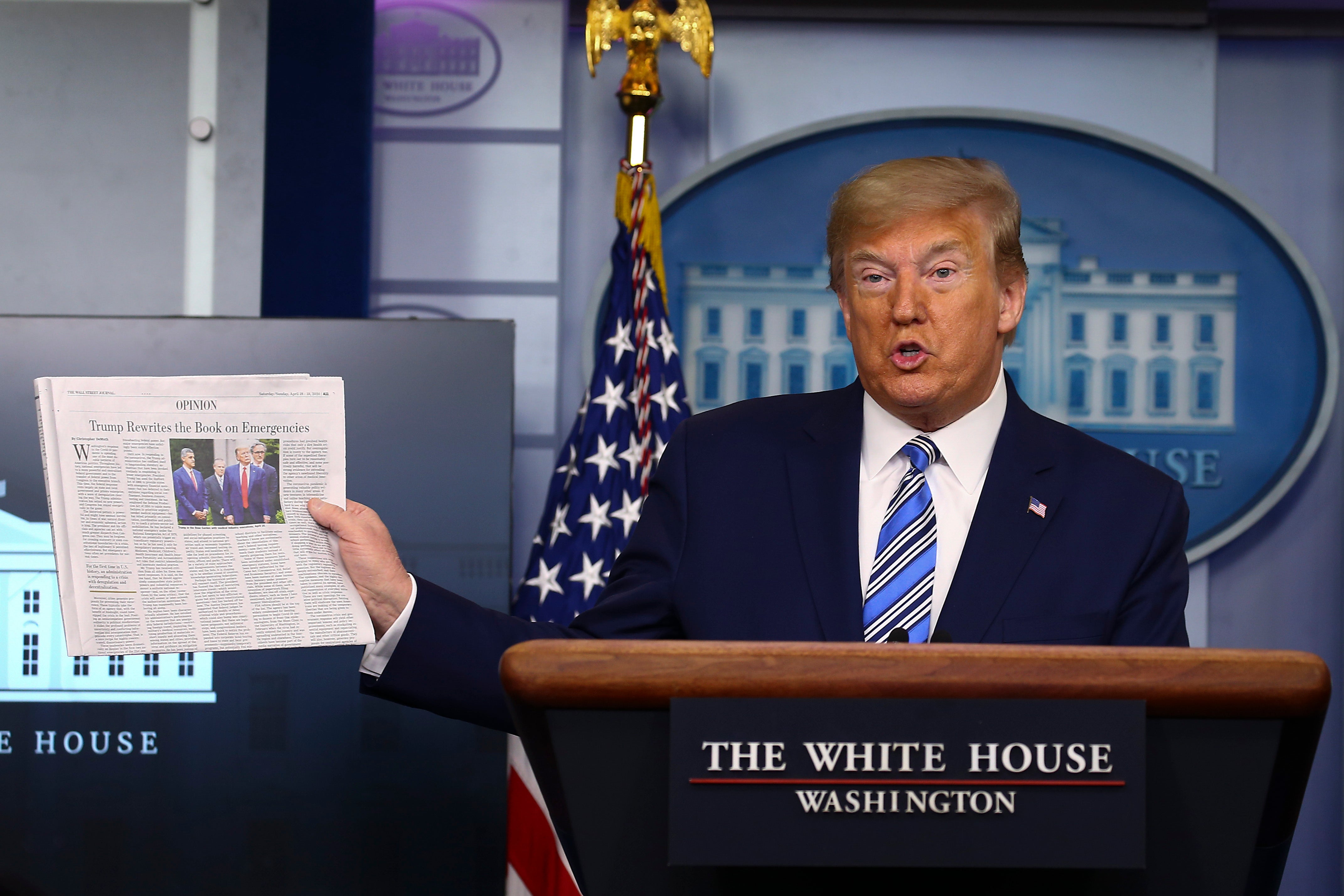 Donald Trump held up a WSJ paper at a news conference in 2020. The newspaper has always been friendly to the former president – though still critical of him at times.