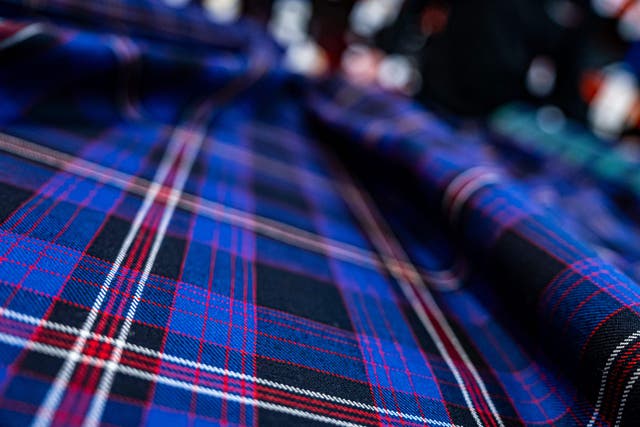 A close-up shot of the newly designed Interpol tartan (Interpol/PA)