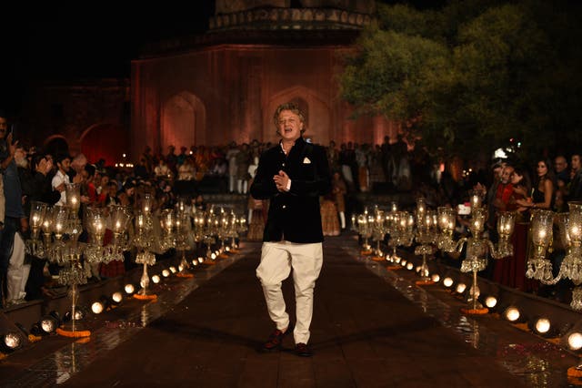 <p>File Indian designer Rohit Bal walks on the catwalk during the Grand Finale of the Wills Lifestyle Indian Fashion Week Spring/Summer 2015 Collection</p>