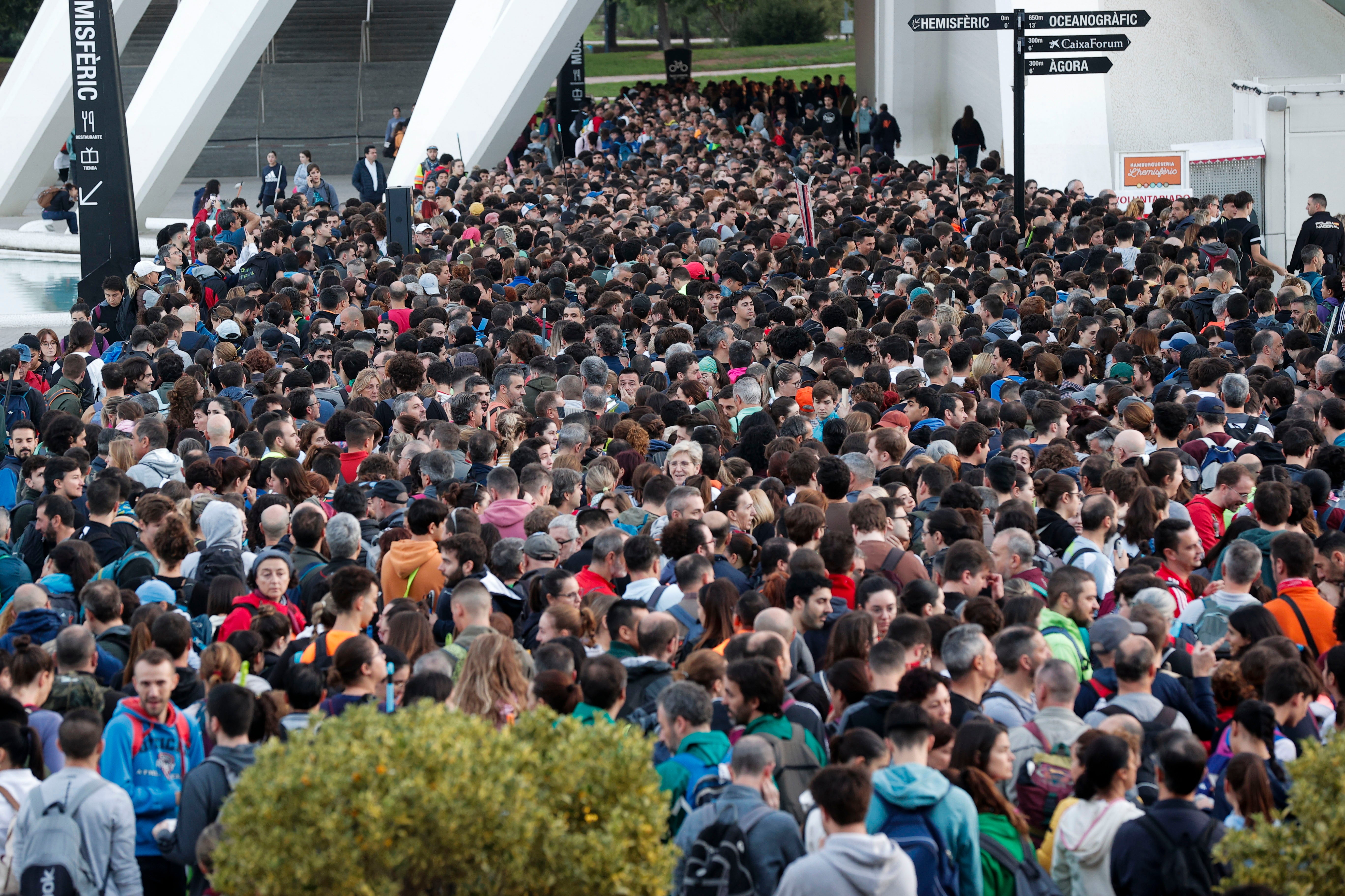 Thousands of people gather at the Ciudad de las Artes y las Ciencias complex to volunteer in helping in the reconstruction and cleaning of towns affected by flash floods