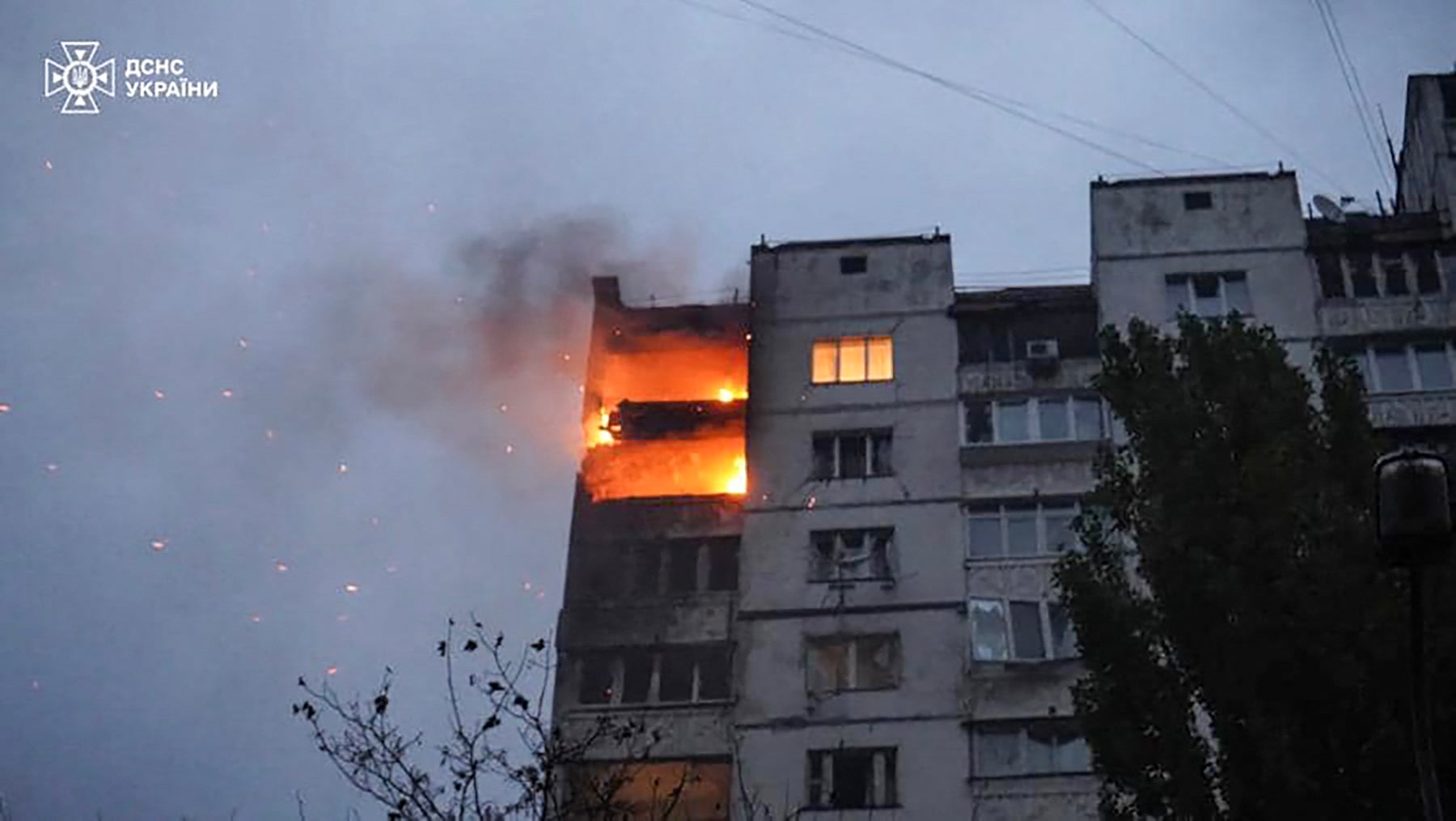 Multi-storey residential building burning as a result of fragments of downed Russian drone