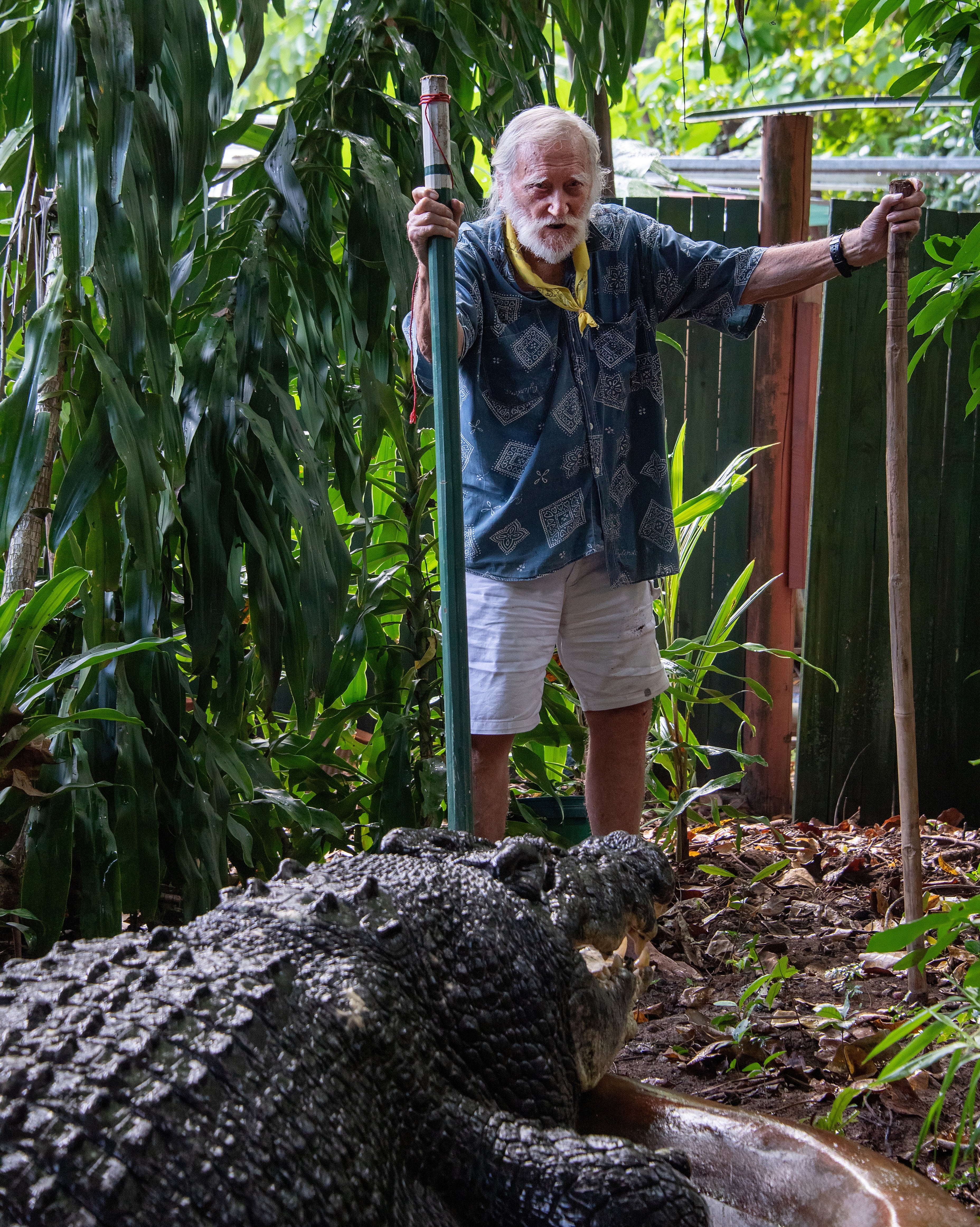 Green Island Marineland Melanesia’s George Craig stands with Cassius the crocodile at the Marineland Melanesia on Green Island, Queensland, Australia, 18 March 2023