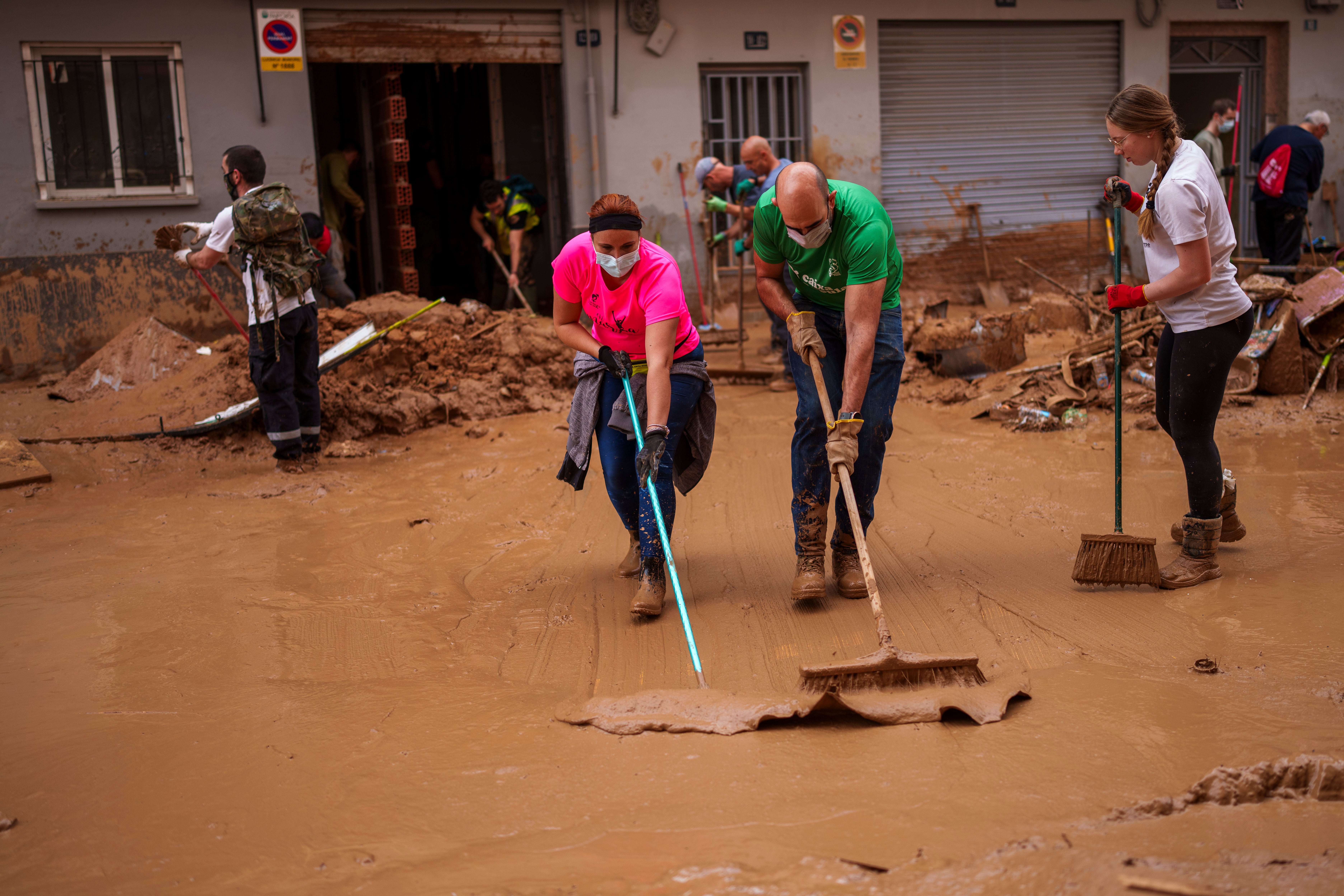 Authorities have recovered 211 bodies after heavy downpours triggered flash floods in eastern Spain (Manu Fernandez/AP)