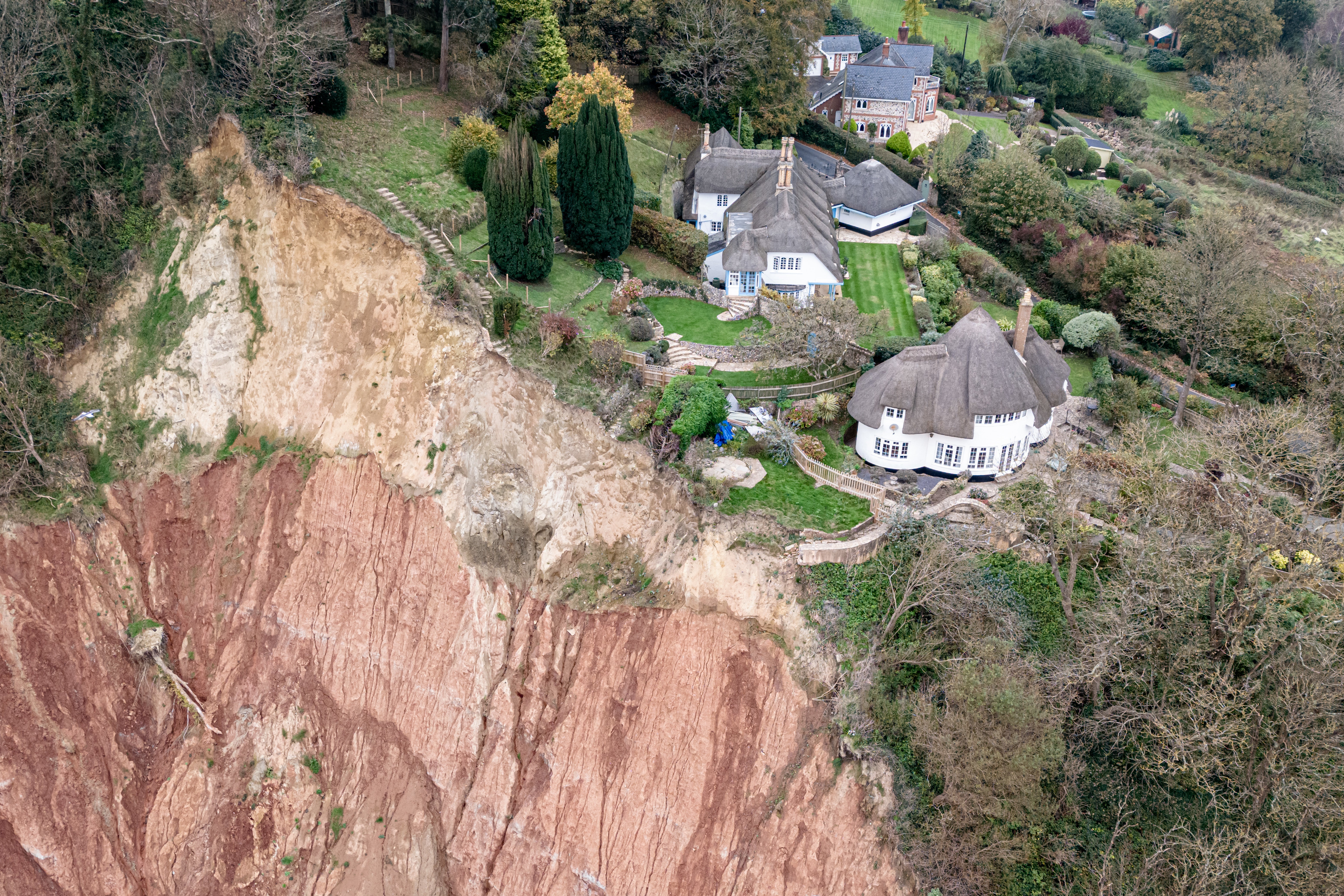 Cottage left teetering on cliff edge following massive landslip | The ...