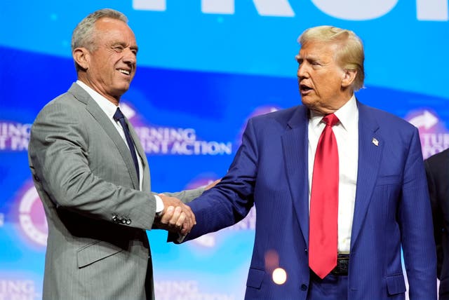 <p>Republican presidential nominee former President Donald Trump shakes hands with Robert F. Kennedy Jr., at a Turning Point Action campaign rally, Wednesday, Oct. 23, 2024, in Duluth, Ga</p>