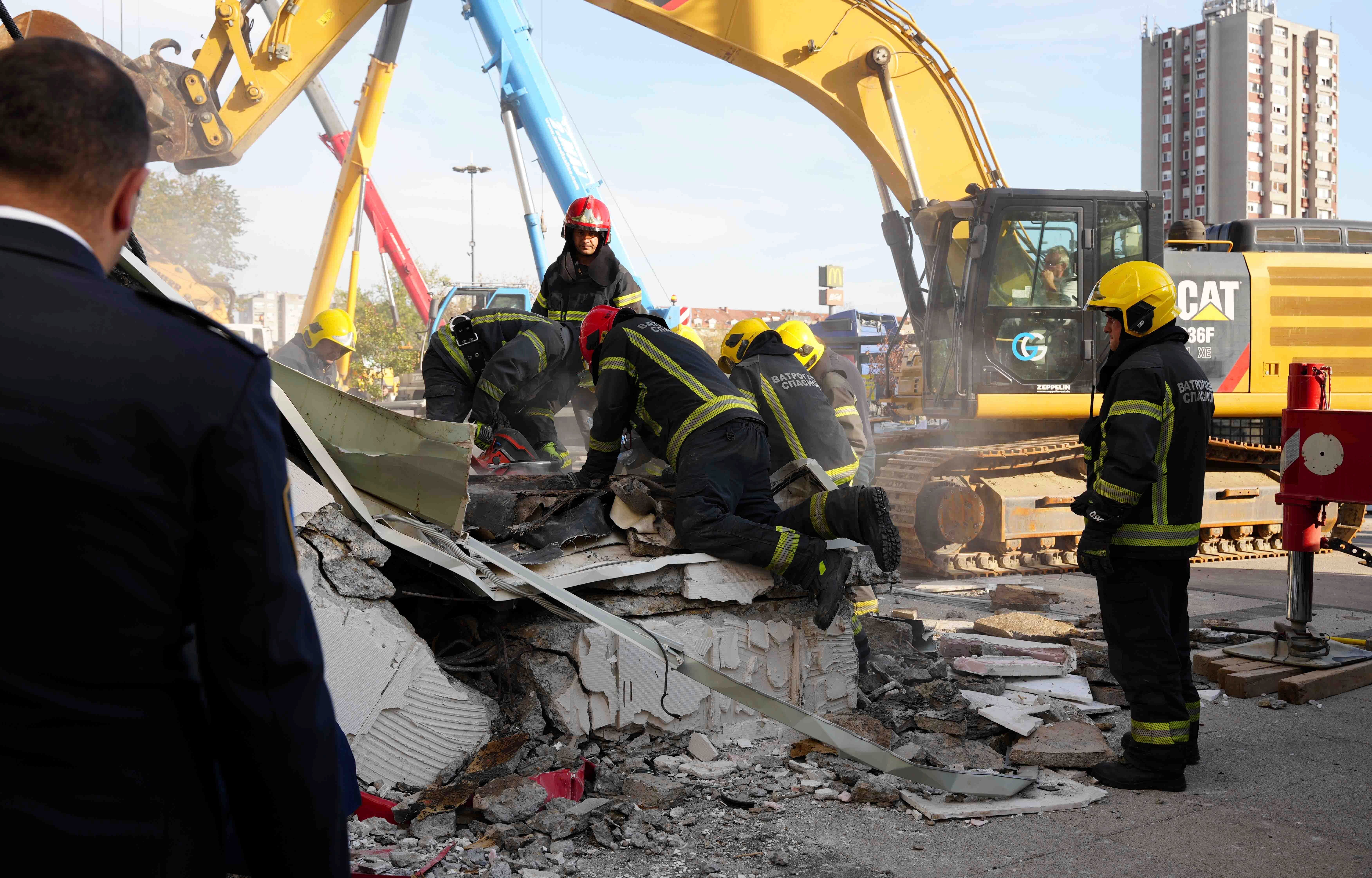 Rescue service workers inspect a scene as a roof collapsed at a railway station, Friday Nov. 1