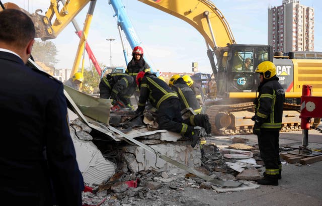 <p>Rescue service workers inspect a scene as a roof collapsed at a railway station, Friday Nov. 1</p>