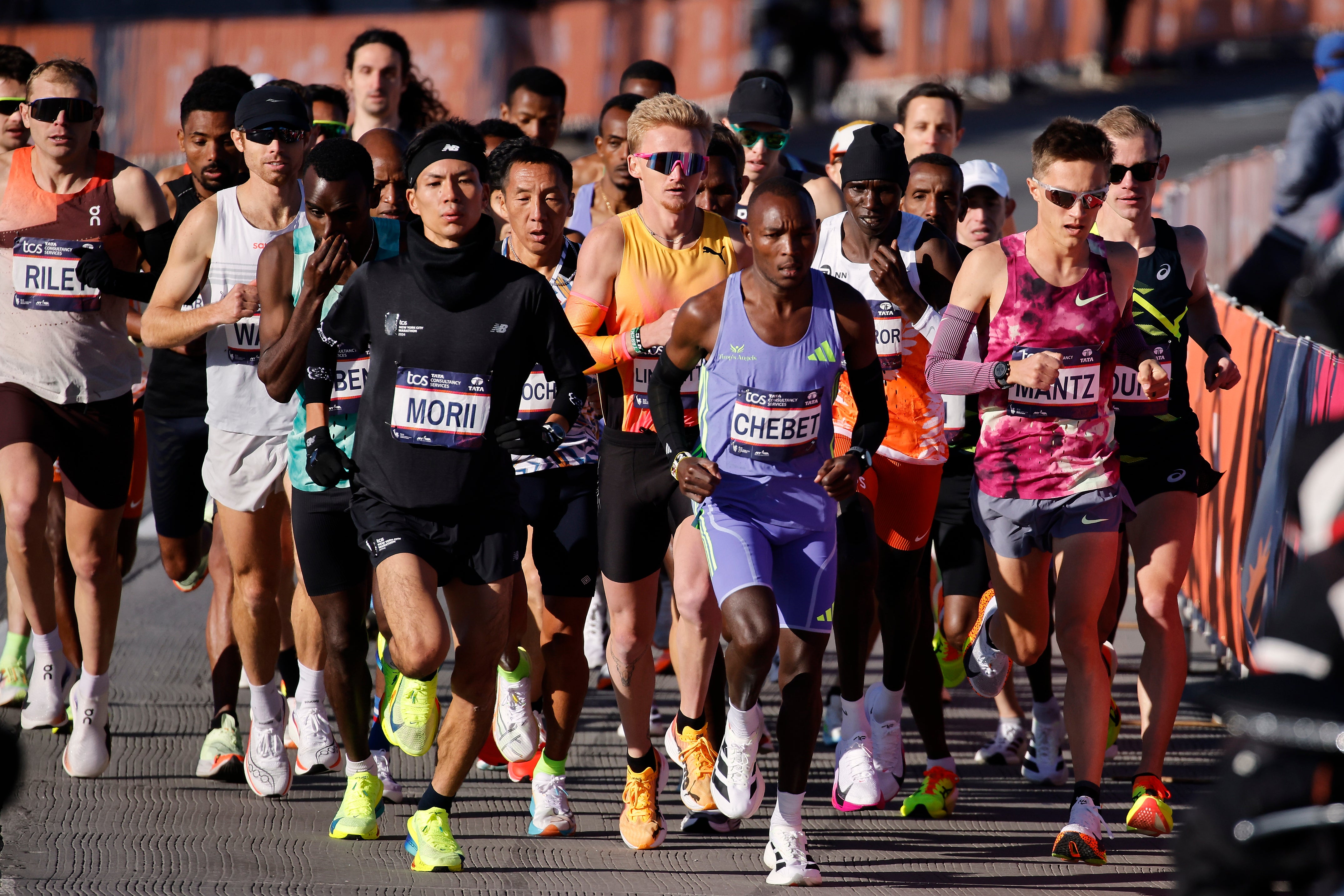 Yuma Morii of Japan makes his way onto the Verrazzano Narrows bridge with runners in the men's elite division