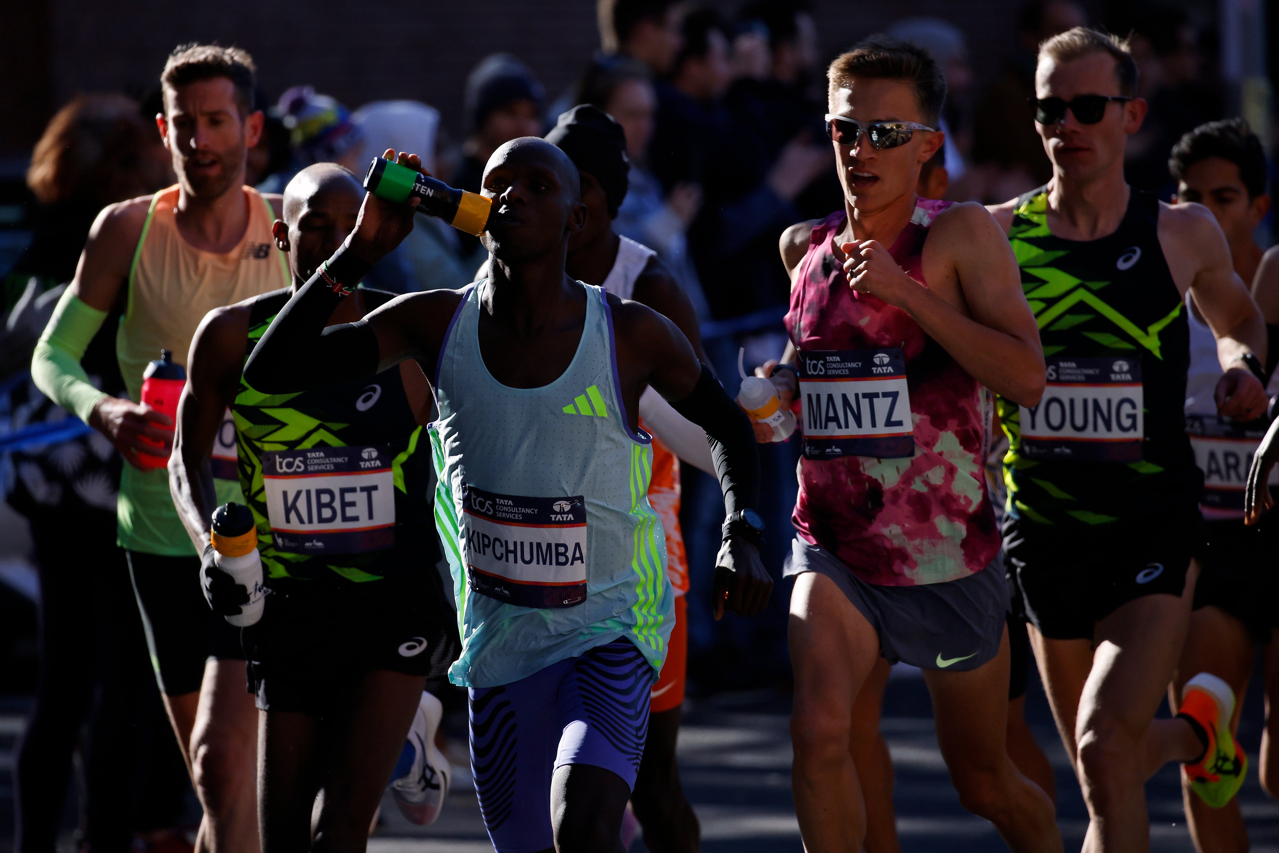 Runners in the men's elite division make their way through the Brooklyn borough during the New York City Marathon on Sunday