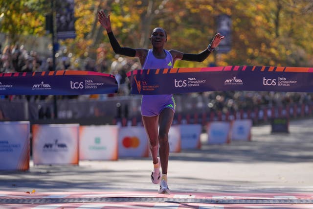 <p>Sheila Chepkirui, 33, crosses the finish line at the New York City Marathon on Sunday </p>