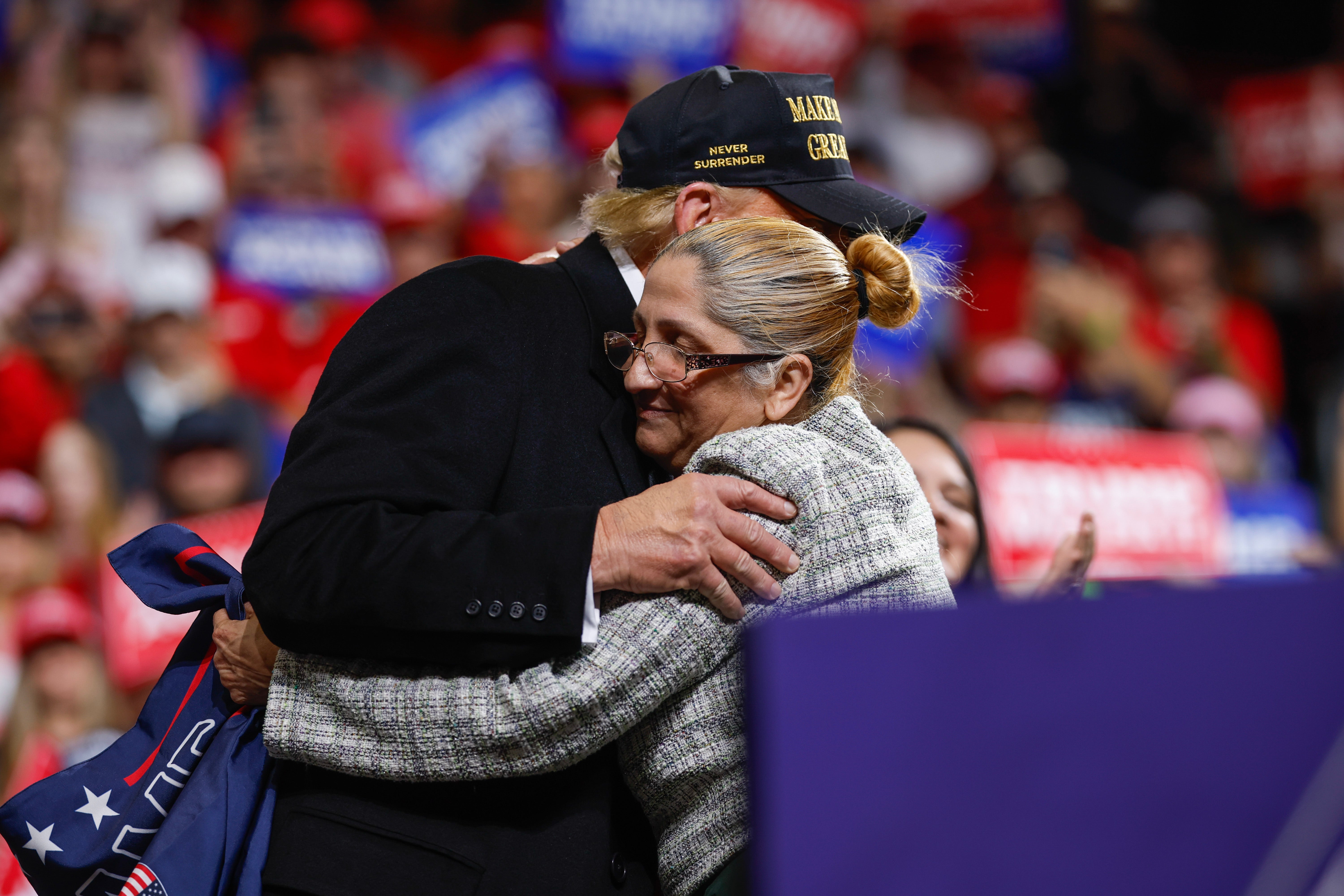 Trump embraces Carmen Ramirez, whose daughter Minelys Zoe Rodriguez Ramirez went missing and was found dead near a Georgia Walmart in October