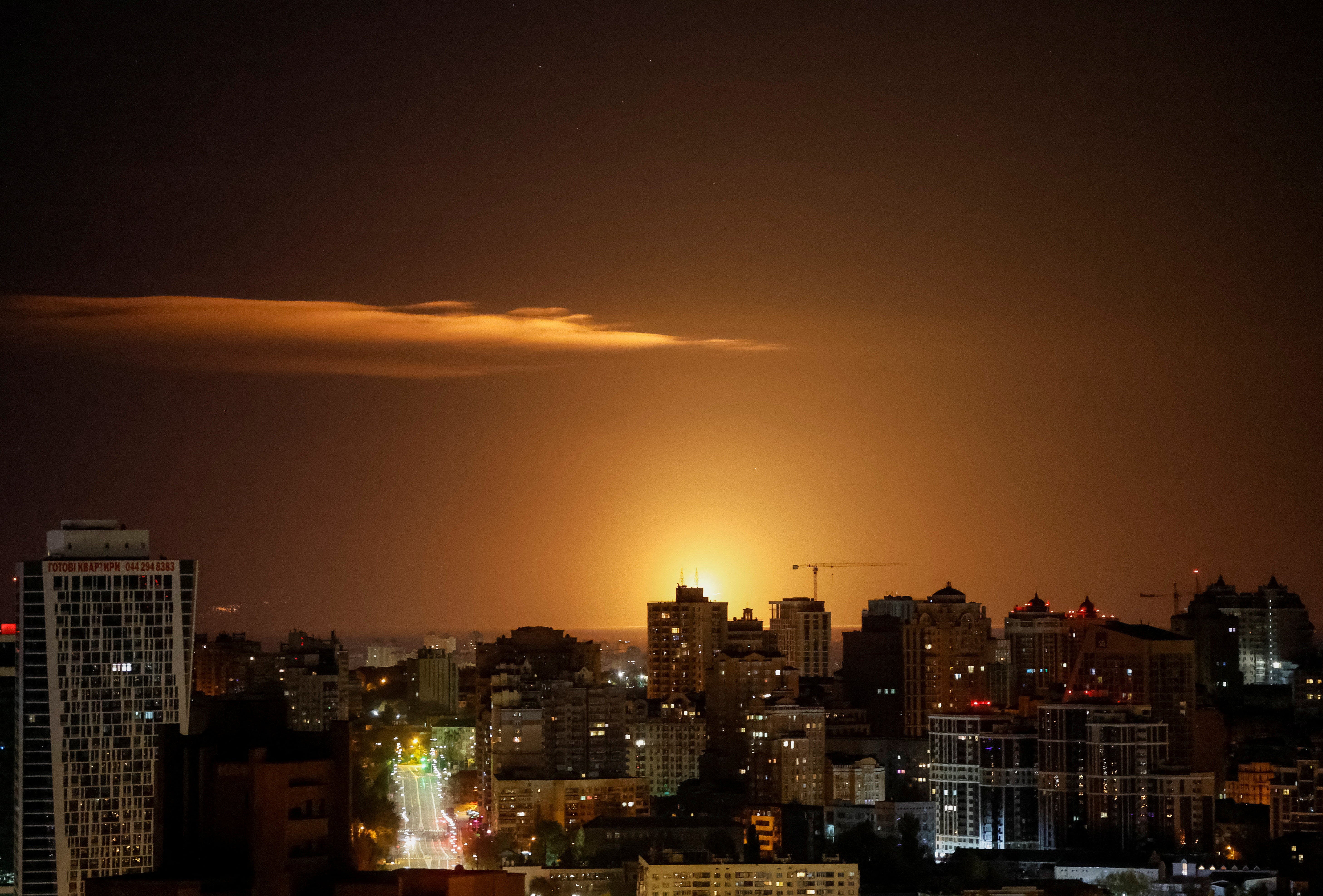 An explosion of a drone is seen in the sky over Kyiv