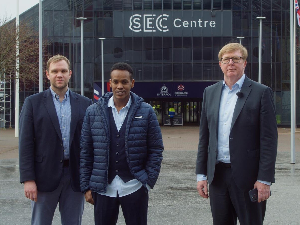 Matthew Hedges, Ali Issa Ahmad and barrister Rodney Dixon stand outside the SEC centre in Glasgow on Sunday, where the Interpol general assembly is due to start on Monday