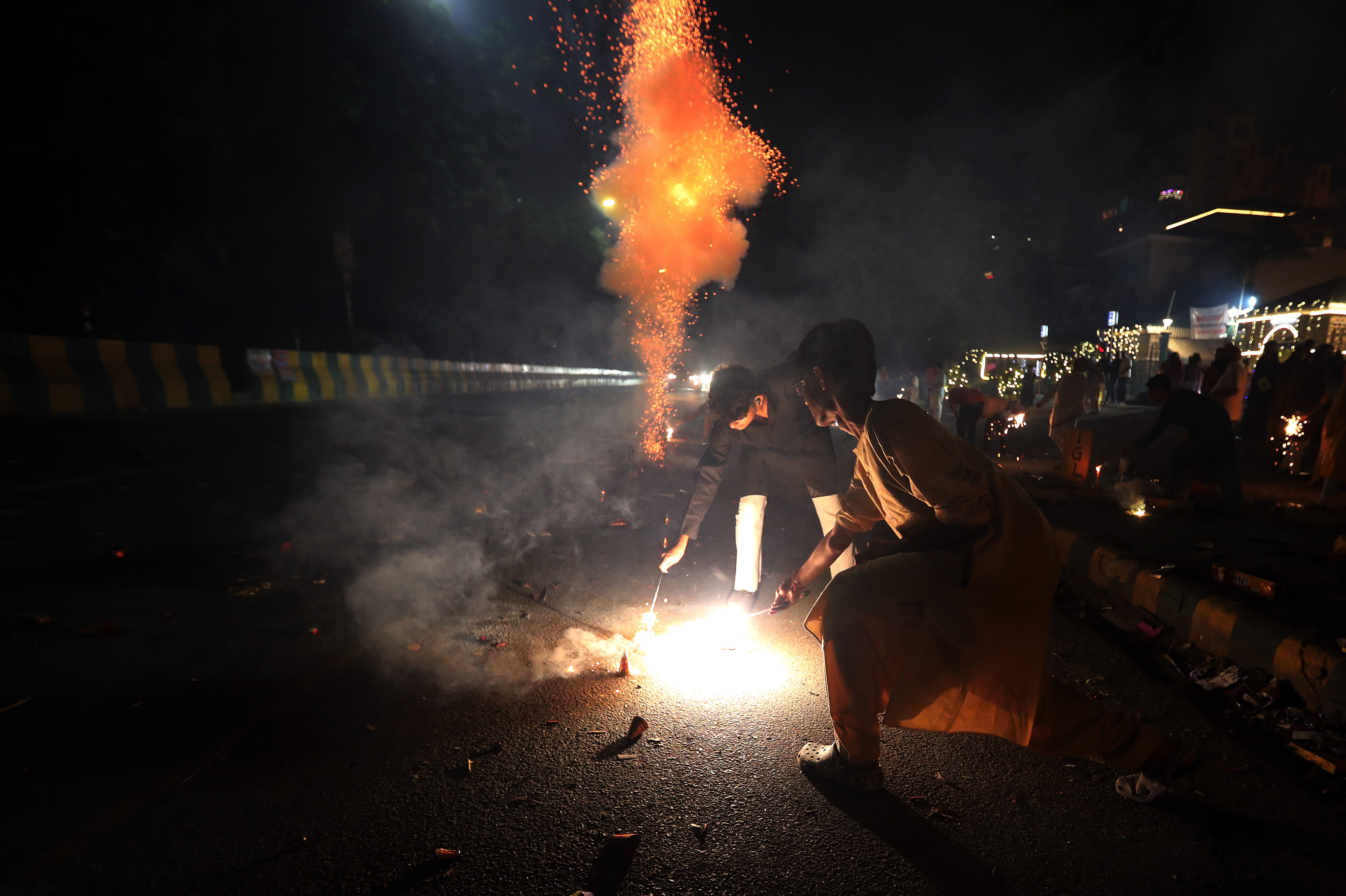 eople light sparklers and crackers during Diwali celebrations near New Delhi, India, 31 October 2024