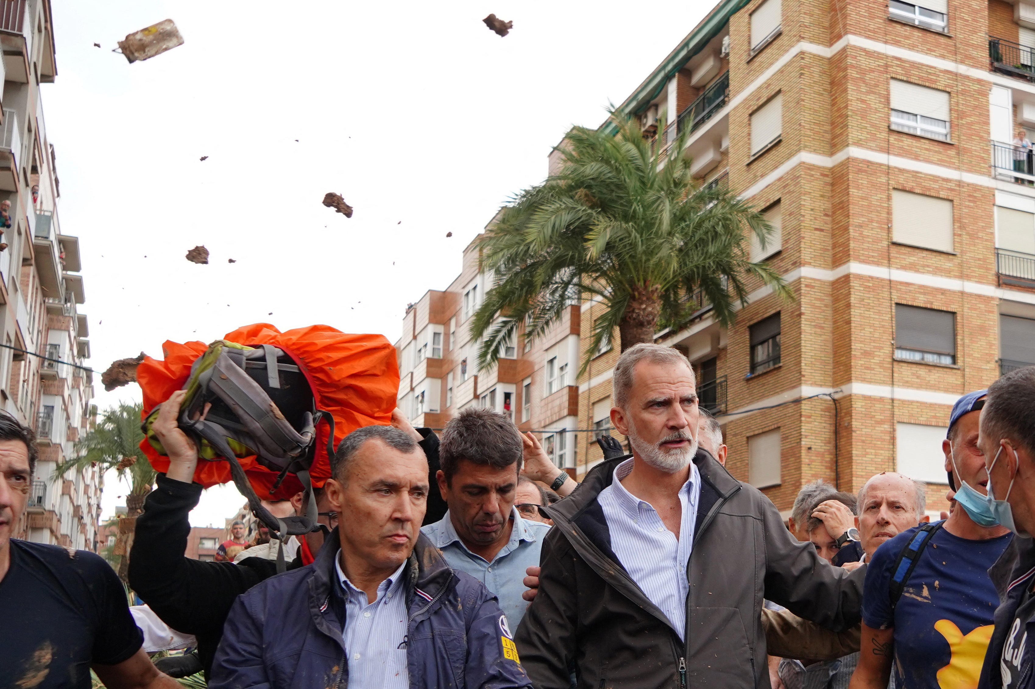 <p>King Felipe VI of Spain (right) is heckled by angry residents who throw mud and objects during his visit to Paiporta, in the region of Valencia</p>