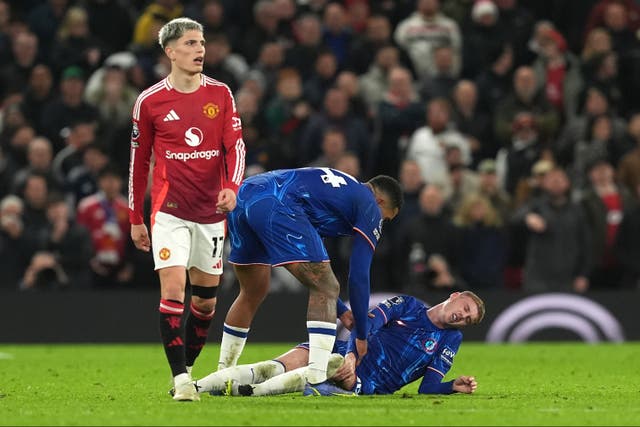 <p>Cole Palmer was injured in a tackle from Lisandro Martinez late on at Old Trafford </p>