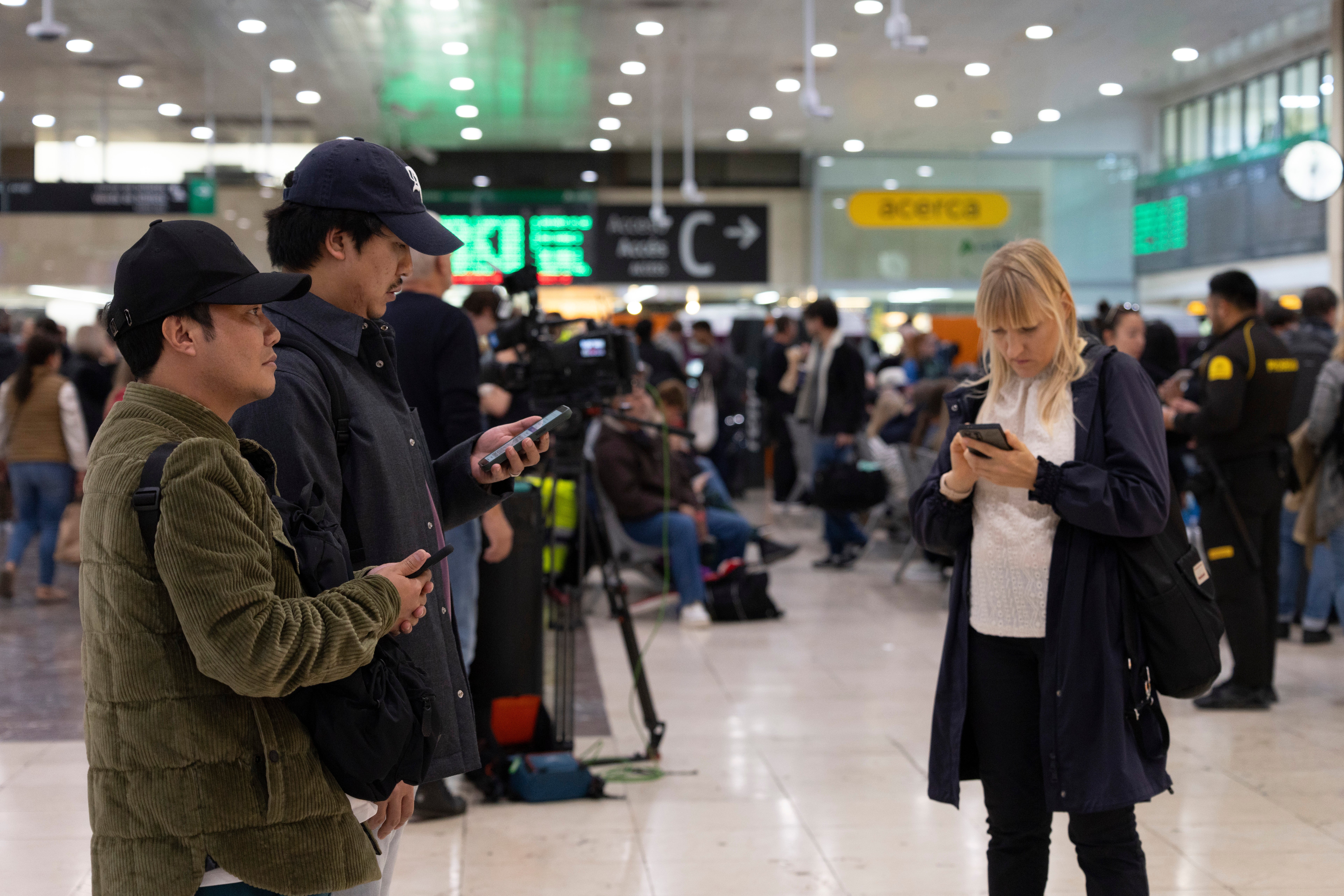 Passengers wait at Sants train station in Barcelona, Catalonia, Spain