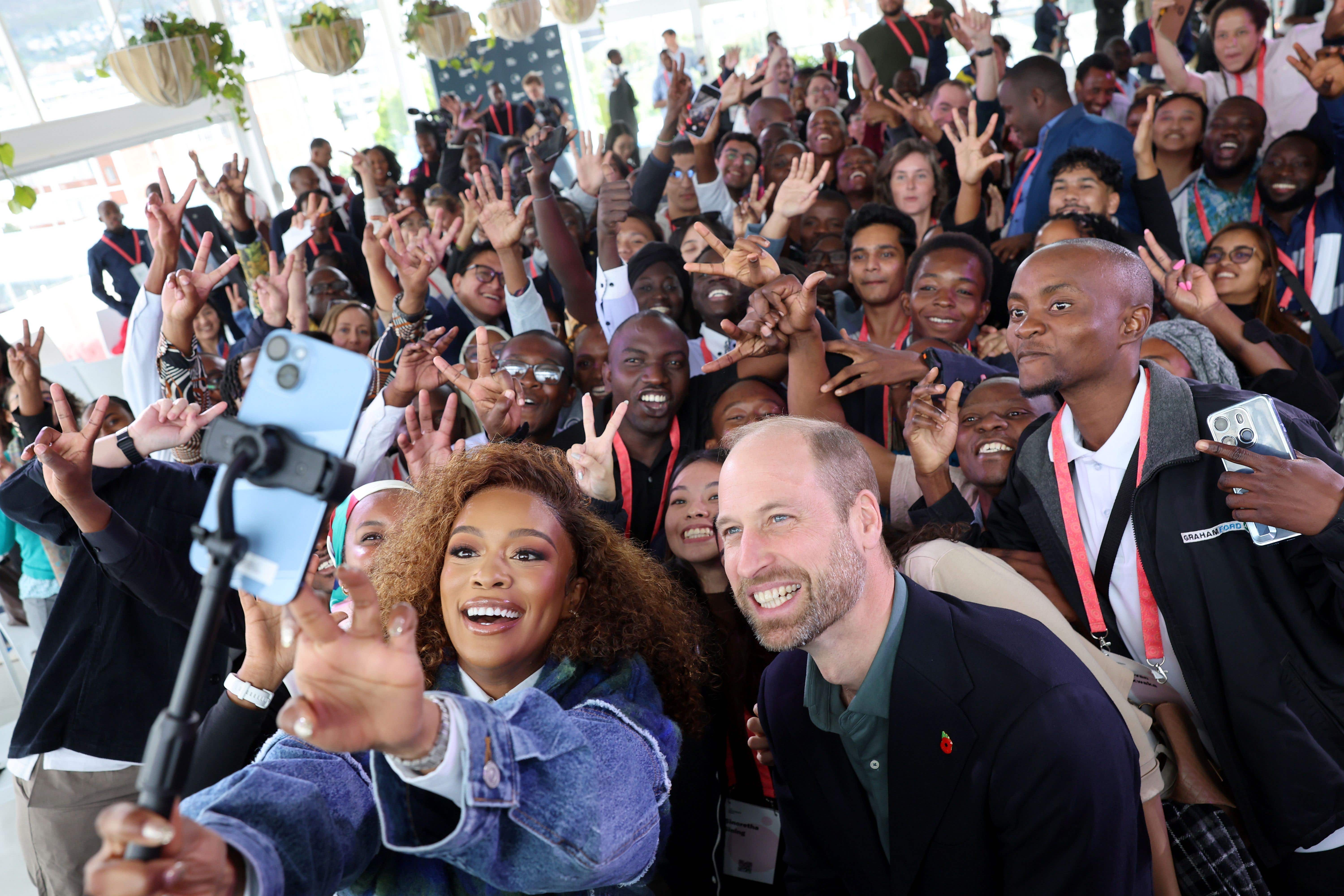 The Prince of Wales and Nomzamo Mbatha (left) pose for a selfie (Chris Jackson/PA)