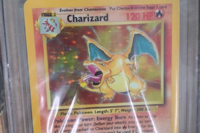 A stolen Pokemon card worth up to £30,000 was returned to its owner (Sussex Police/PA)