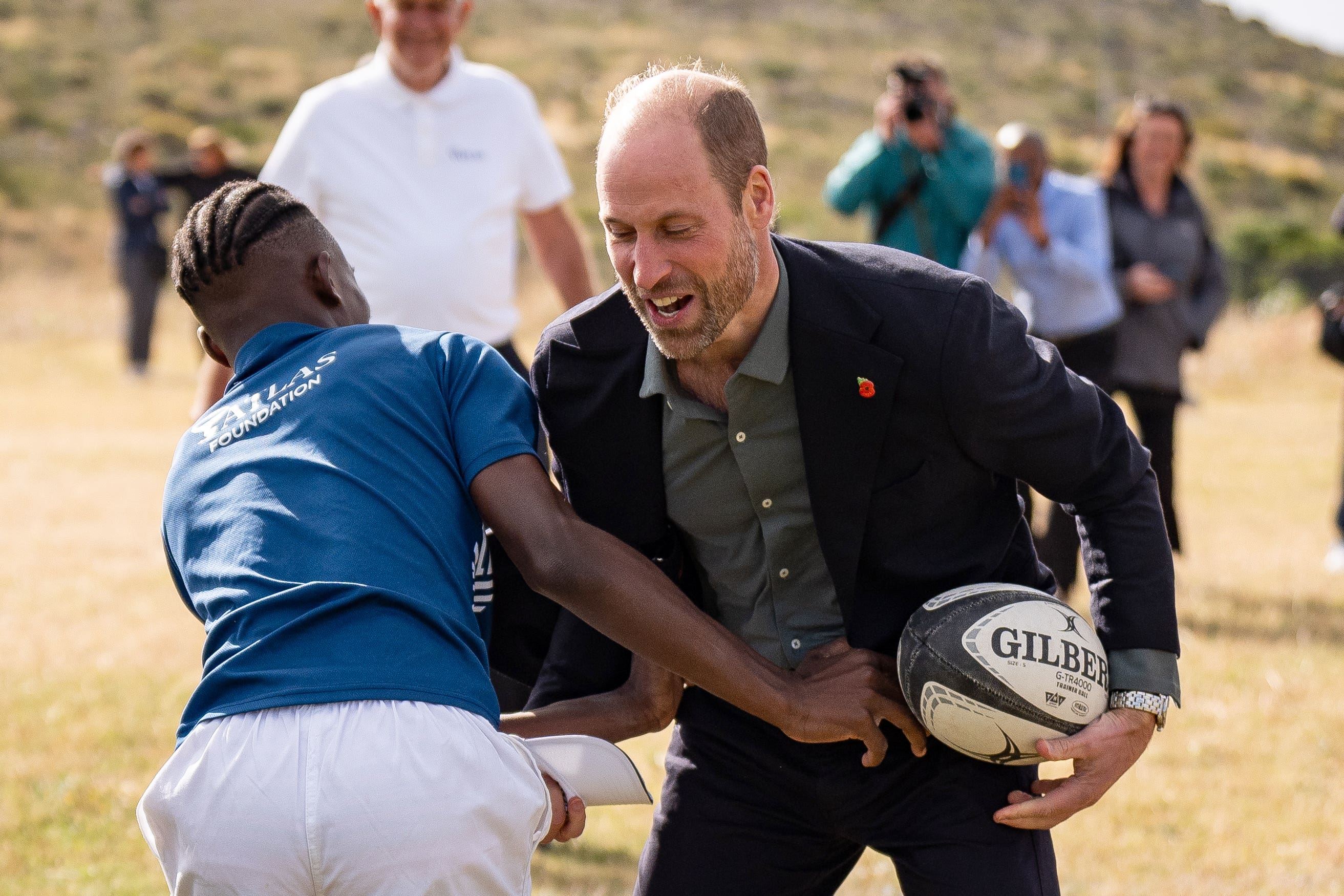 The Prince of Wales takes part in a rugby coaching session (Aaron Chown/PA)