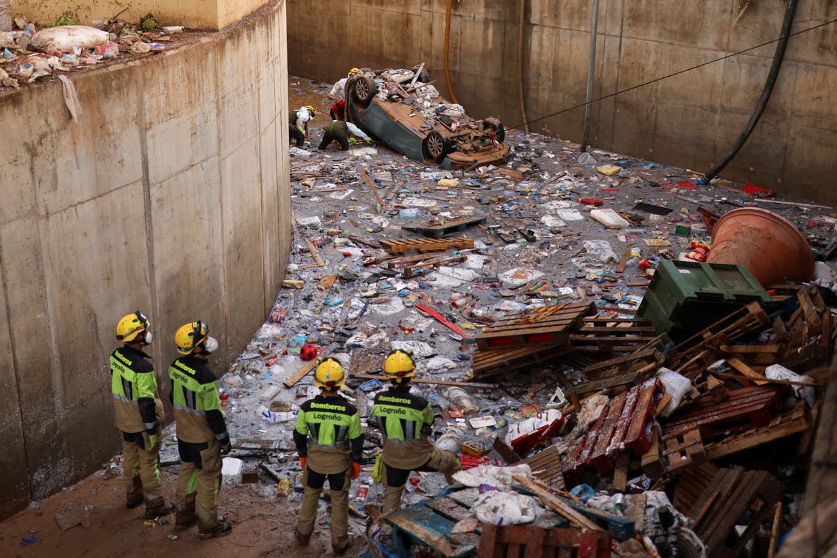 Spain floods latest: Rescuers dig for missing in underground shopping centre