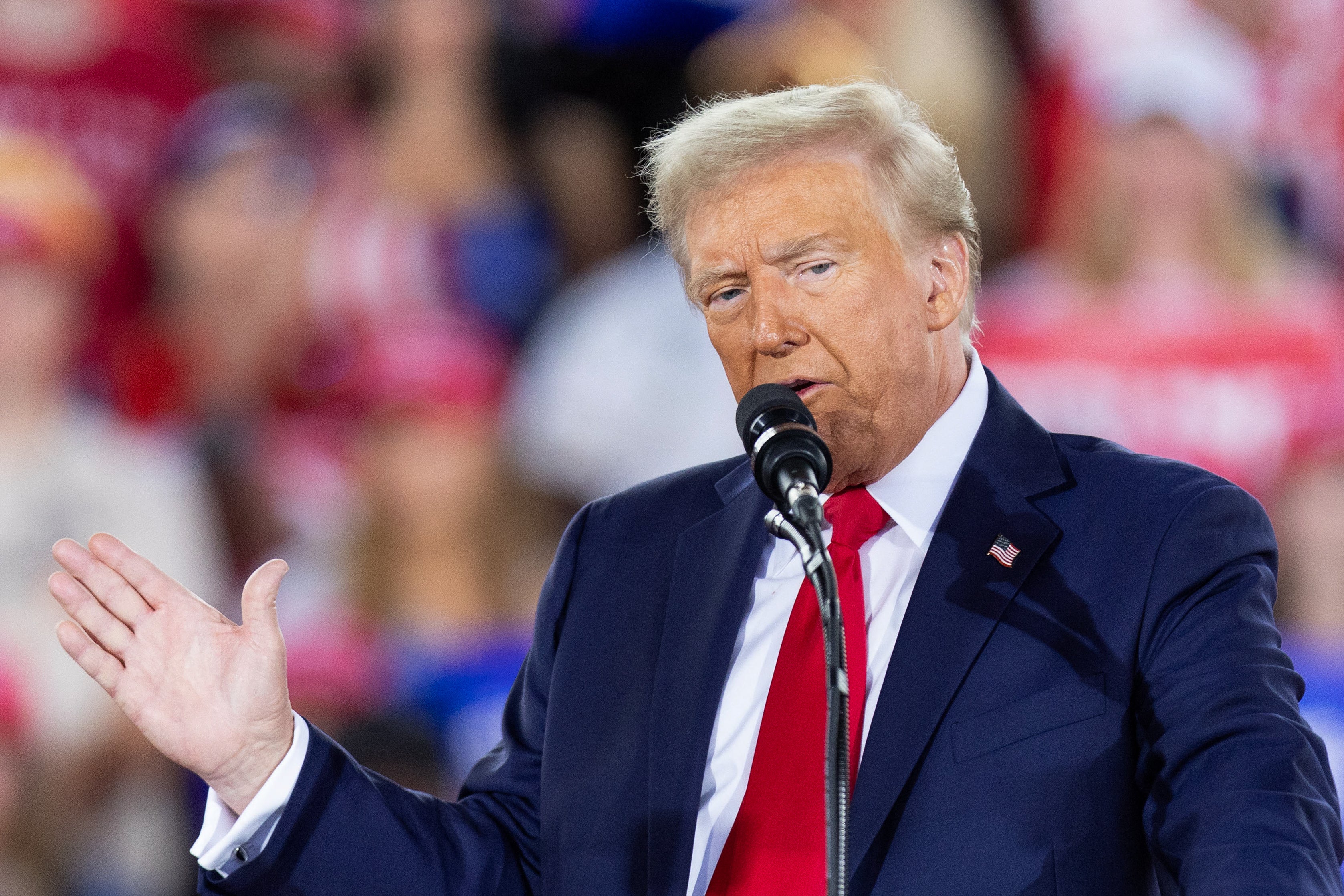 Donald Trump speaks in Raleigh, North Carolina on Monday. There, he ripped Nancy Pelosi and said his team talked him down from attacking Michelle Obama