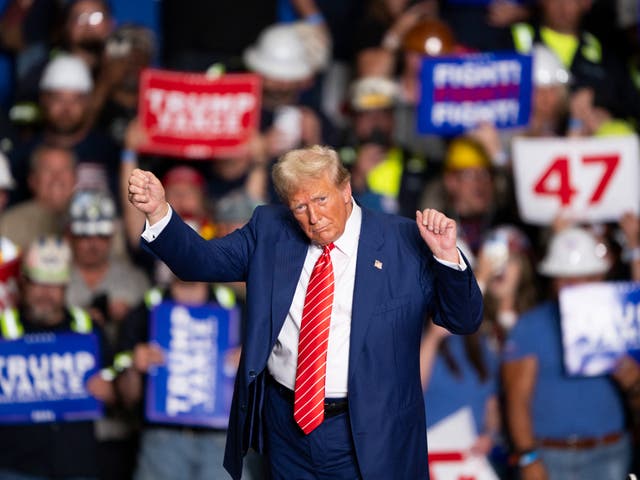 <p>Former US President and Republican presidential candidate Donald Trump dances to a song as he leaves a rally at 1st Summit Arena at the Cambria County War Memorial in Johnstown, Pennsylvania, on August 30, 2024</p>