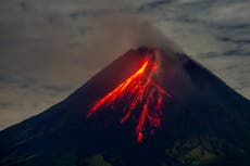 Indonesia volcano erupts: Rescuers dig through ash for survivors after nine killed 