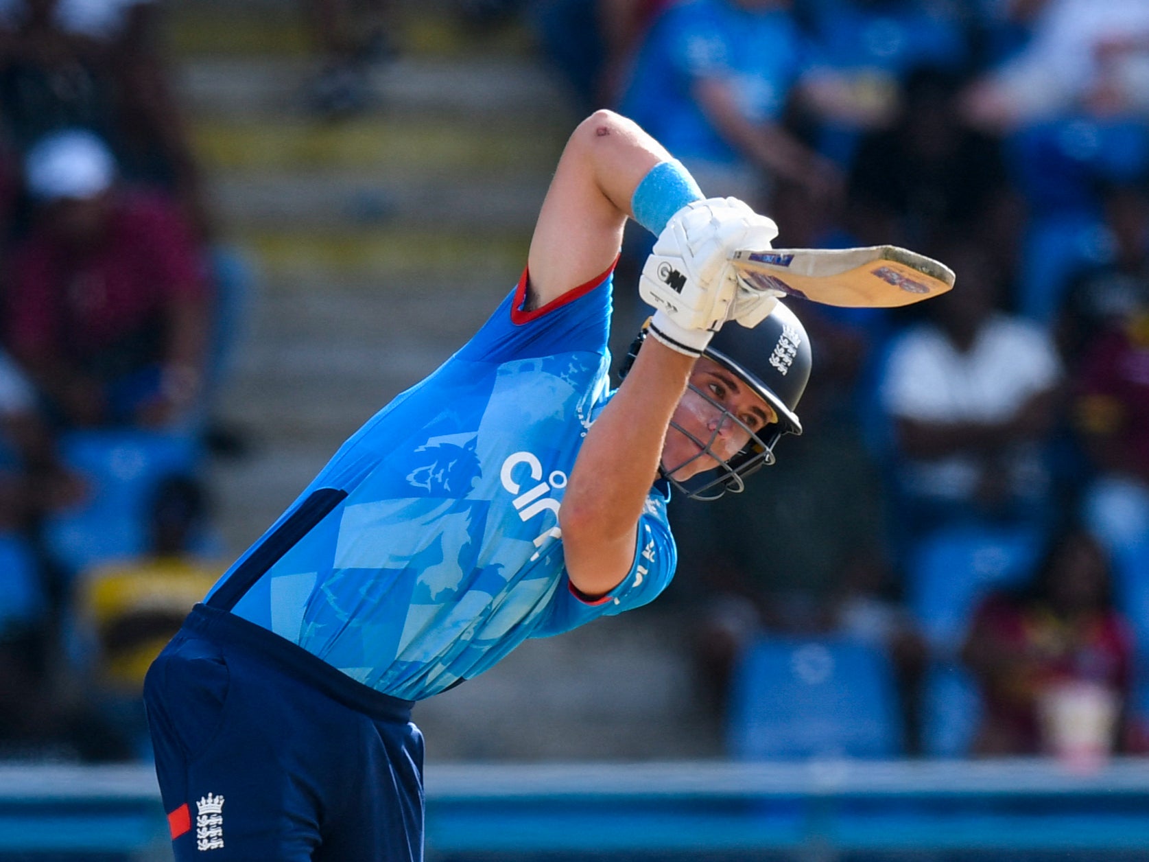 England’s Jacob Bethell hits a four against the West Indies on his way to a half century in Antigua