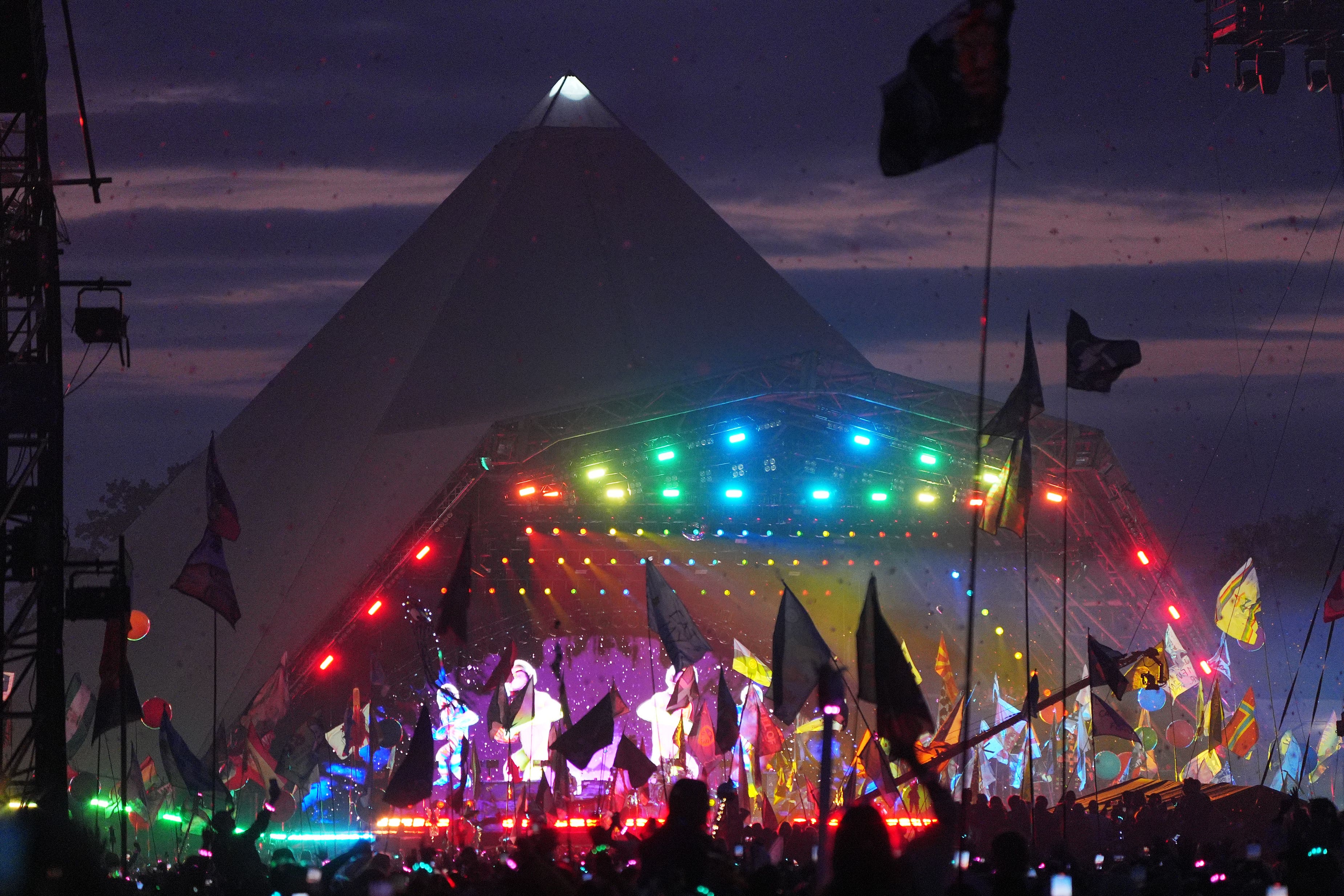 The crowd watching Coldplay performing on the Pyramid Stage at the Glastonbury Festival (Yui Mok/PA)