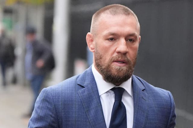 Mixed martial arts fighter Conor McGregor leaves the High Court in Dublin (Niall Carson/PA)