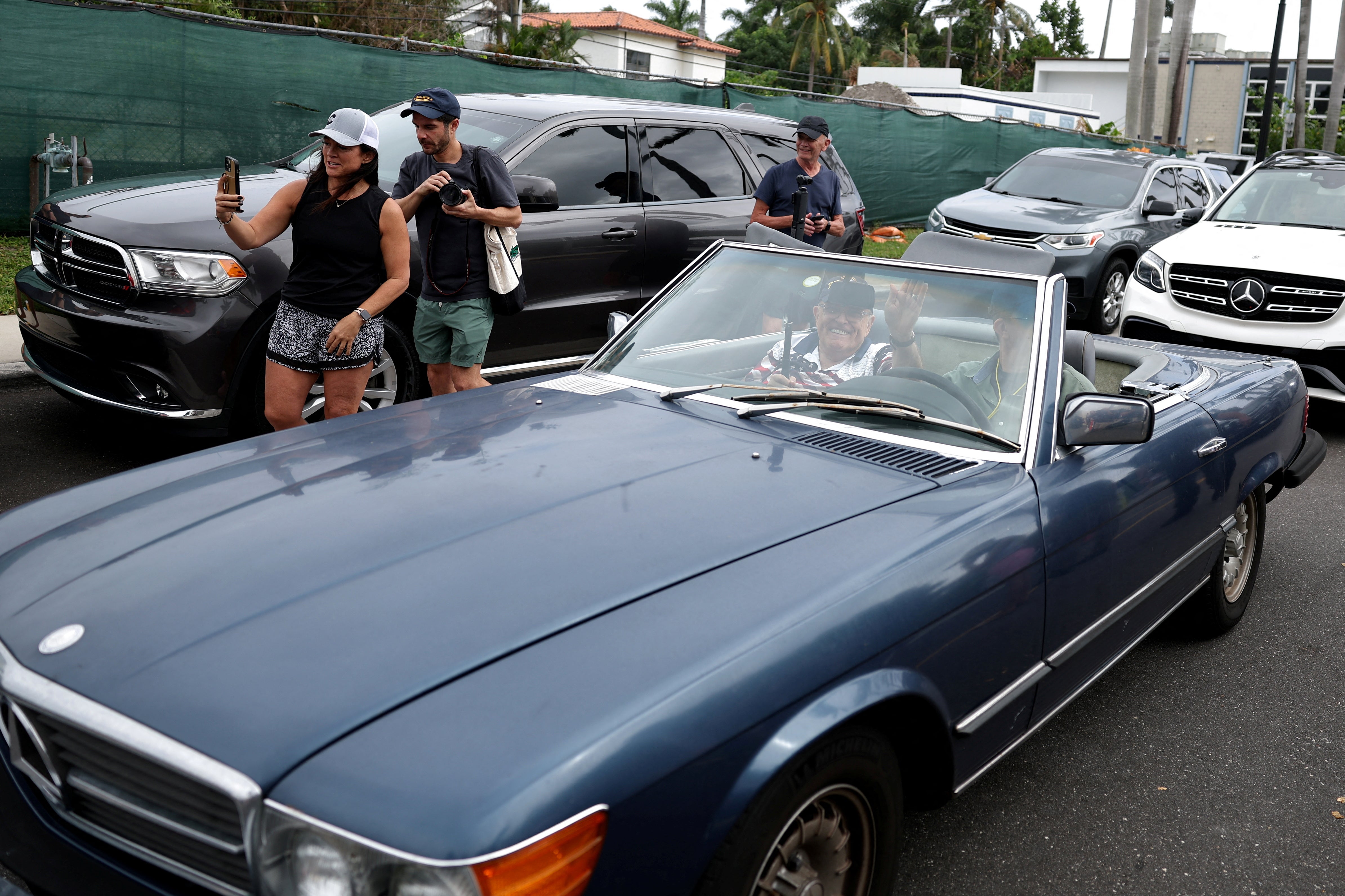 Rudy Giuliani waves as he arrives outside Donald Trump’s polling place in Florida on November 5.