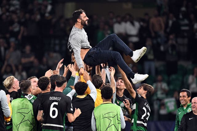 Sporting Lisbon manager Ruben Amorim is tossed into the air by his players after the final whistle (Zed Jameson/PA)