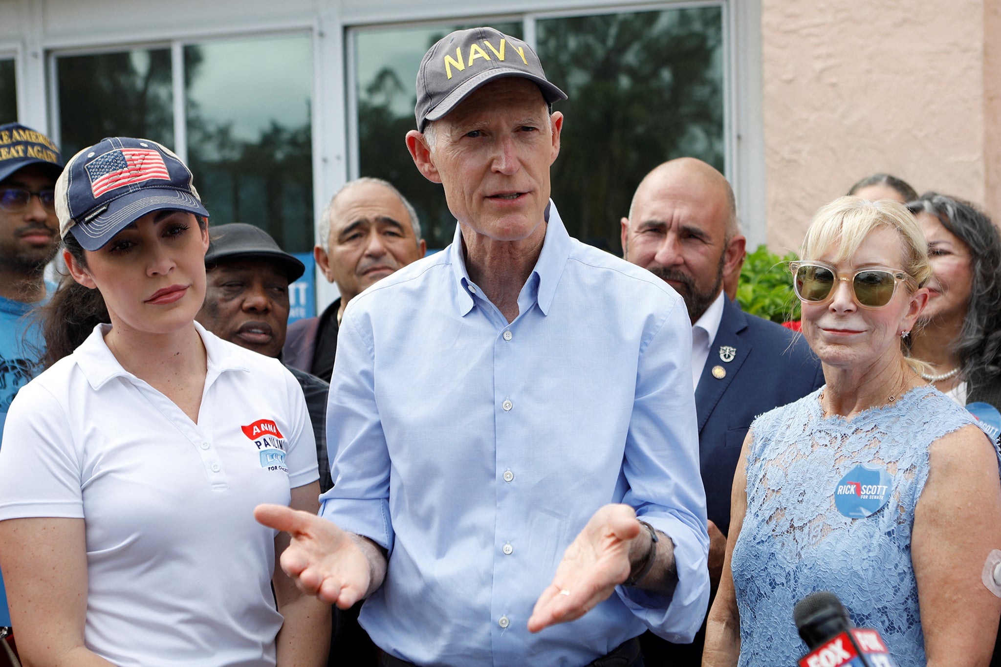 Rick Scott, with congressional candidate Anna Paulina Luna, left, campaigning in Tampa on Election Day. Both held on to their seats