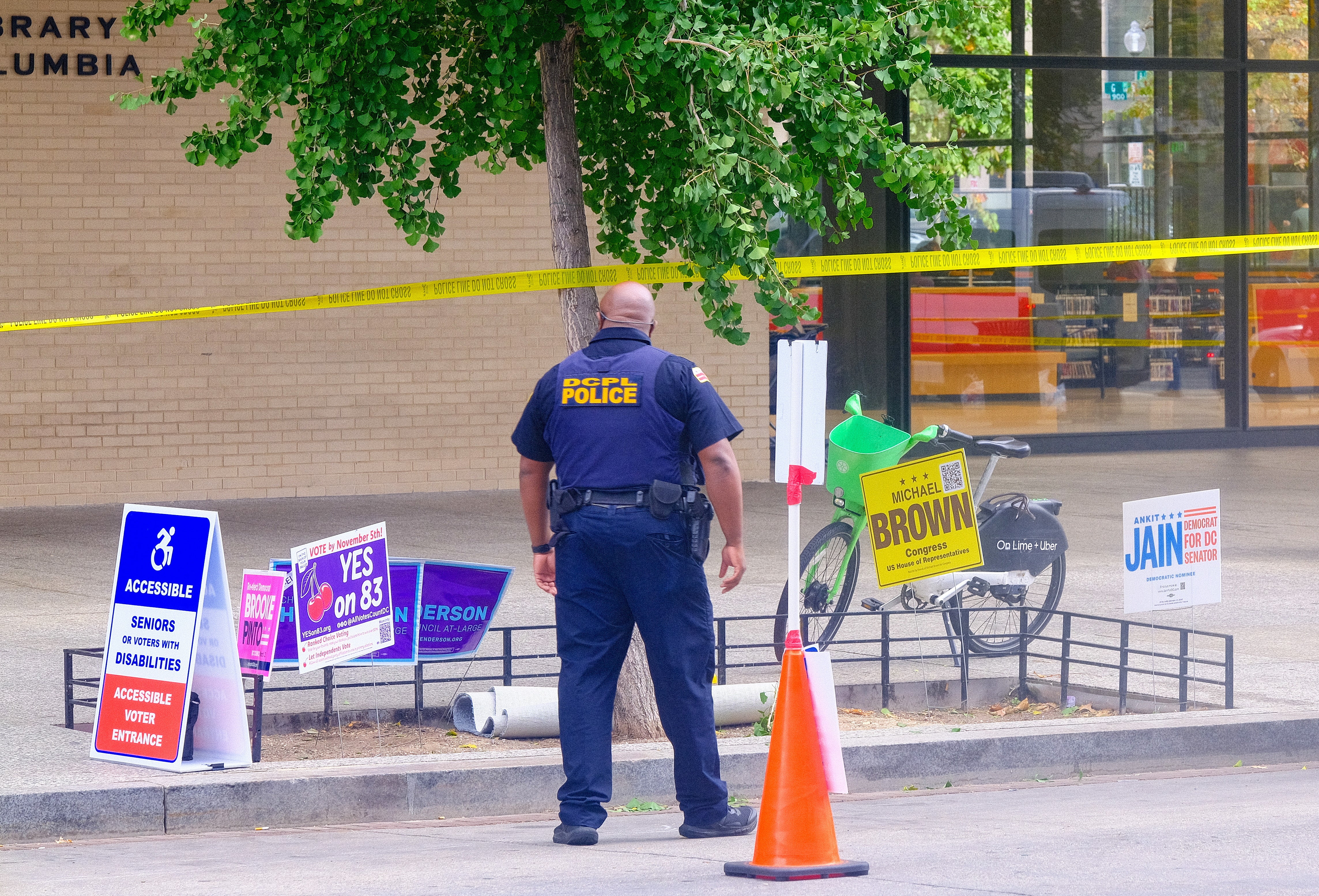 An officer in DC stands near an unidentified object - that turned out to be not a threat. Communities across the nation have dealt with hoaxes throughout Election Day