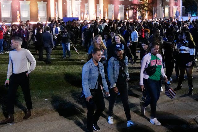 Supporters of Democratic presidential nominee Kamala Harris leave an election night campaign watch party (Mark Schiefelbein/AP)