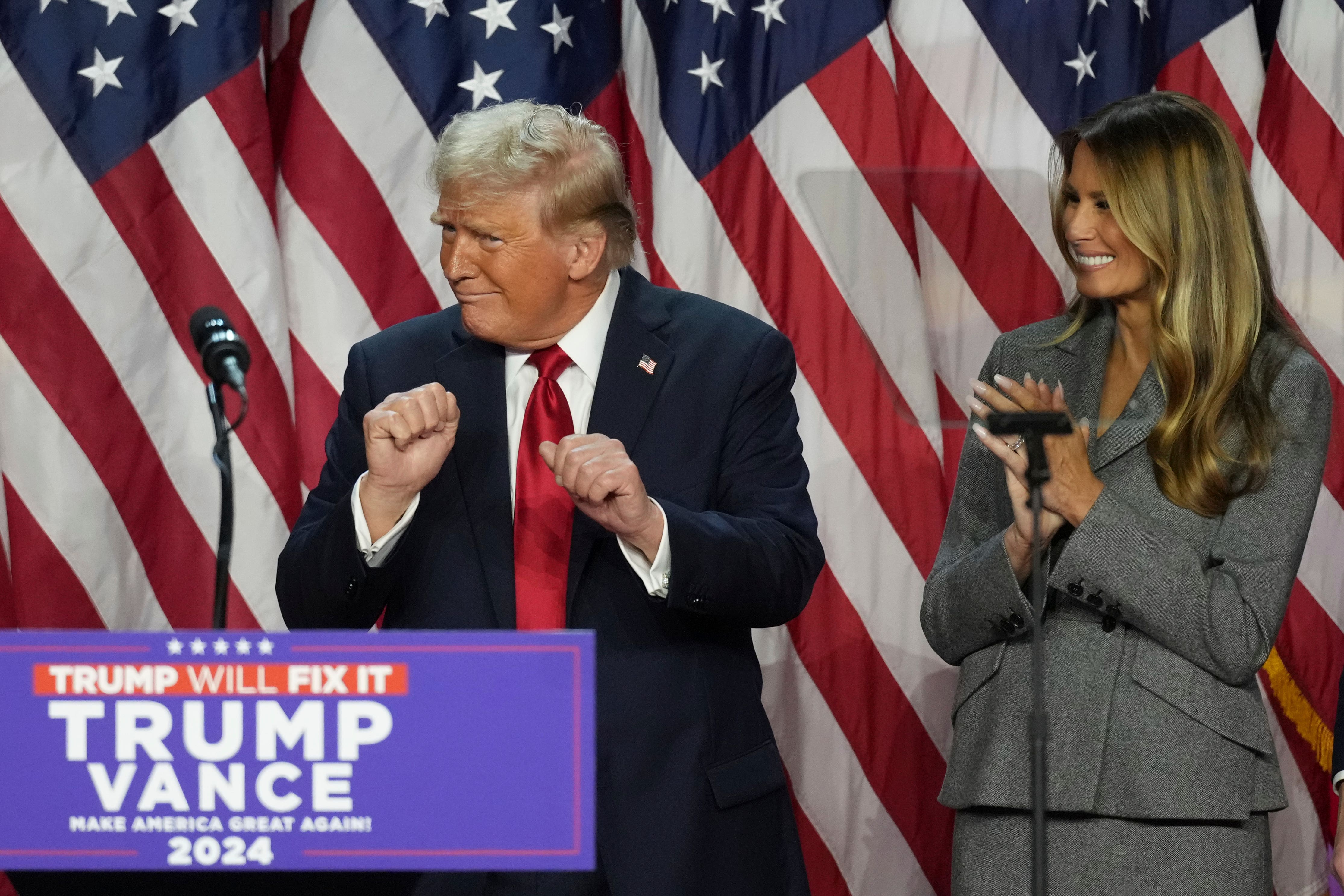 Republican Presidential nominee former President Donald Trump dances as former first lady Melania Trump watches at the Palm Beach County Convention Centre (Lynne Sladky/AP)