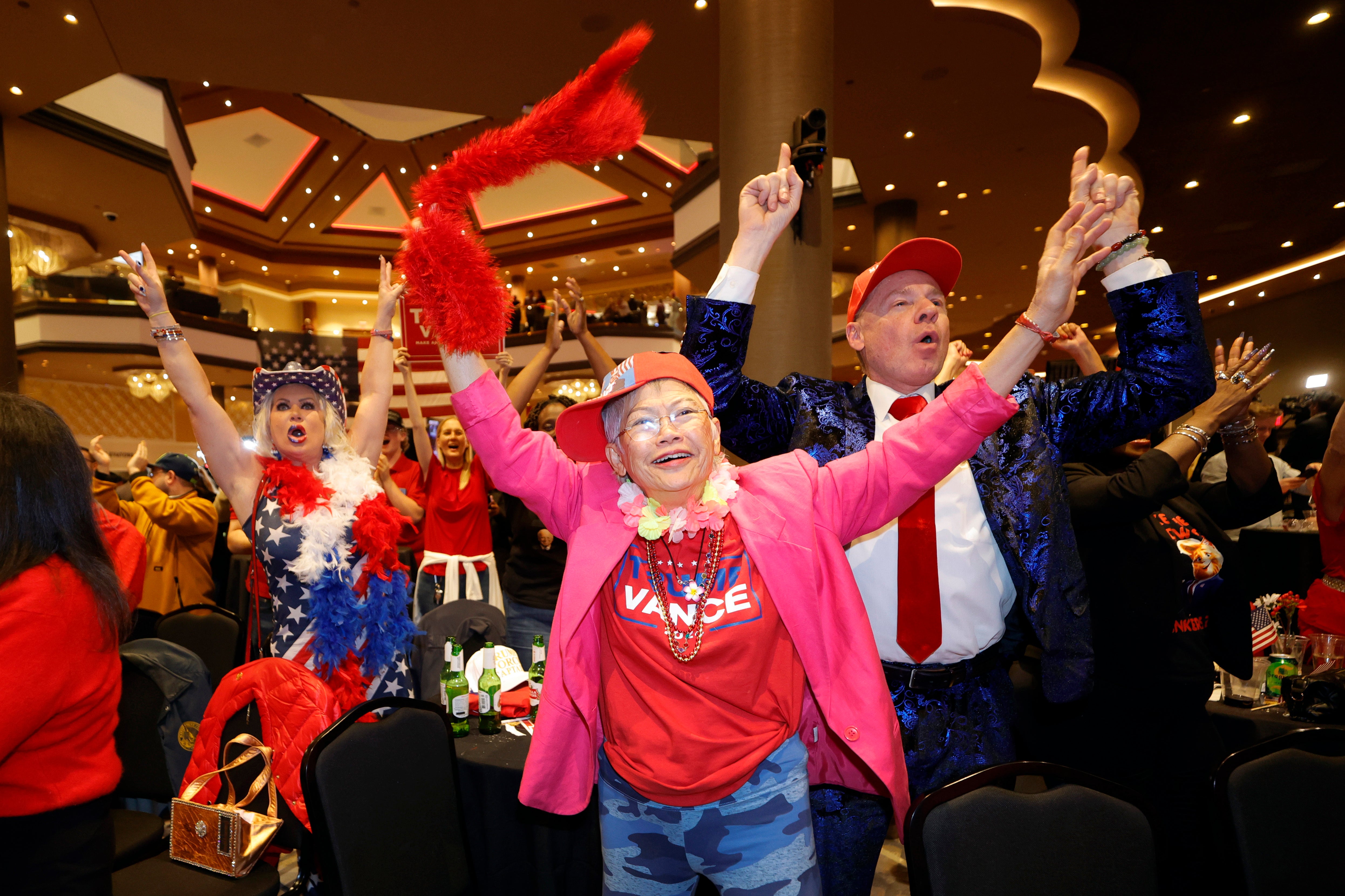 Trump supporters cheer as Fox News calls the election for their candidate