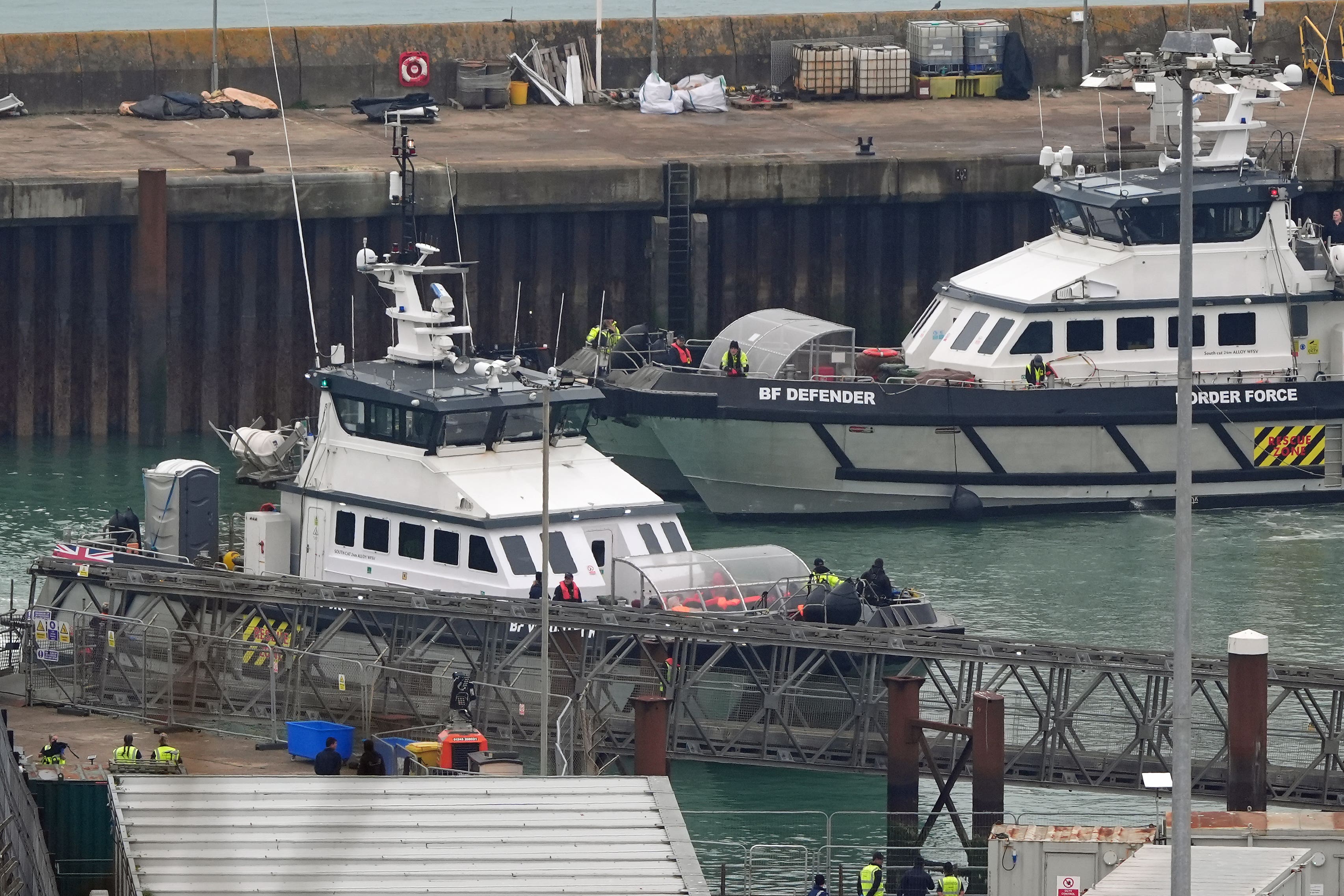 A group of people thought to be migrants are brought in to Dover, Kent, onboard a Border Force vessel following a small boat incident in the Channel (Gareth Fuller/PA)